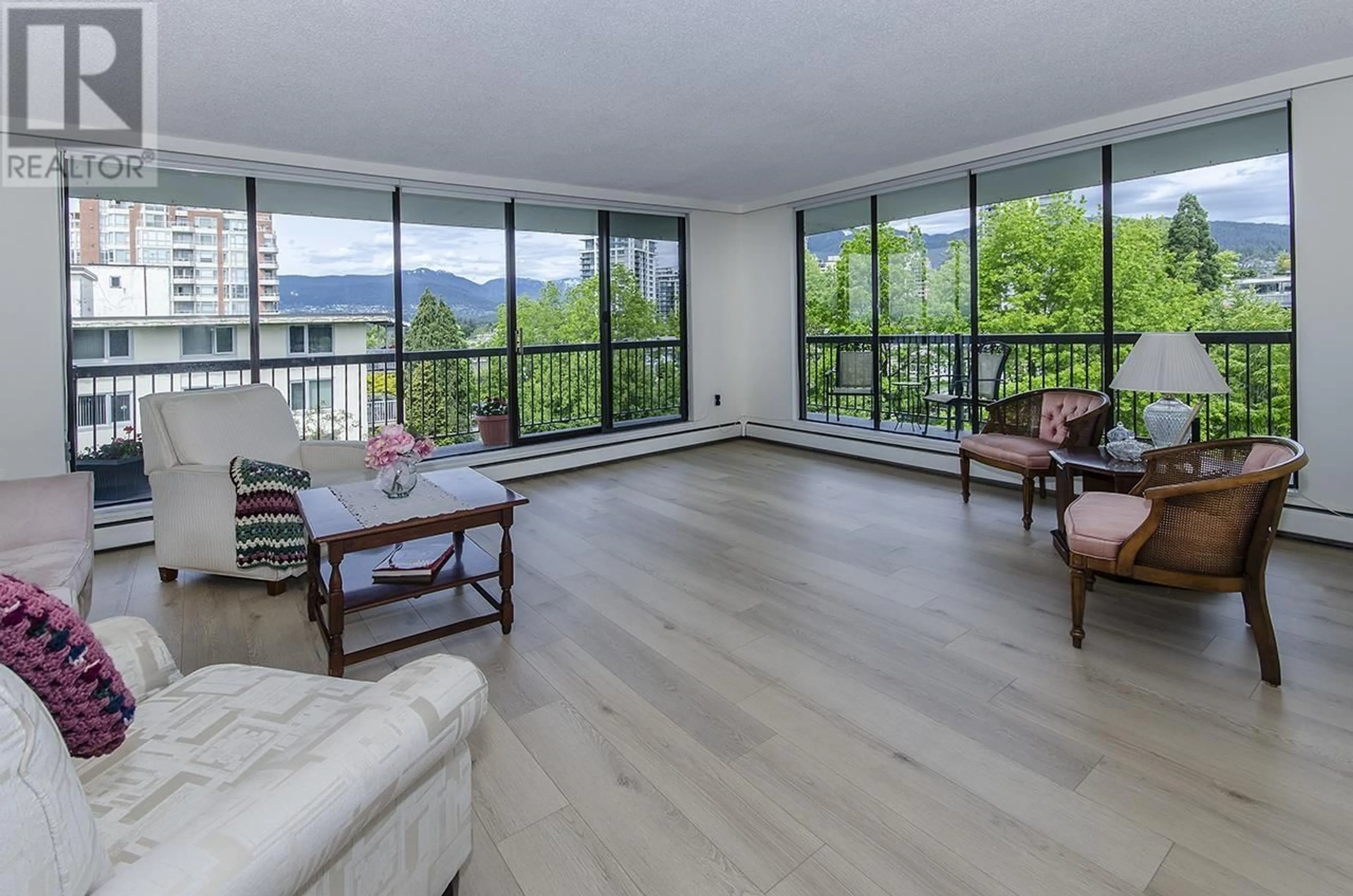 Living room with furniture, wood/laminate floor for 802 - 114 KEITH ROAD, North Vancouver British Columbia V7N3C9