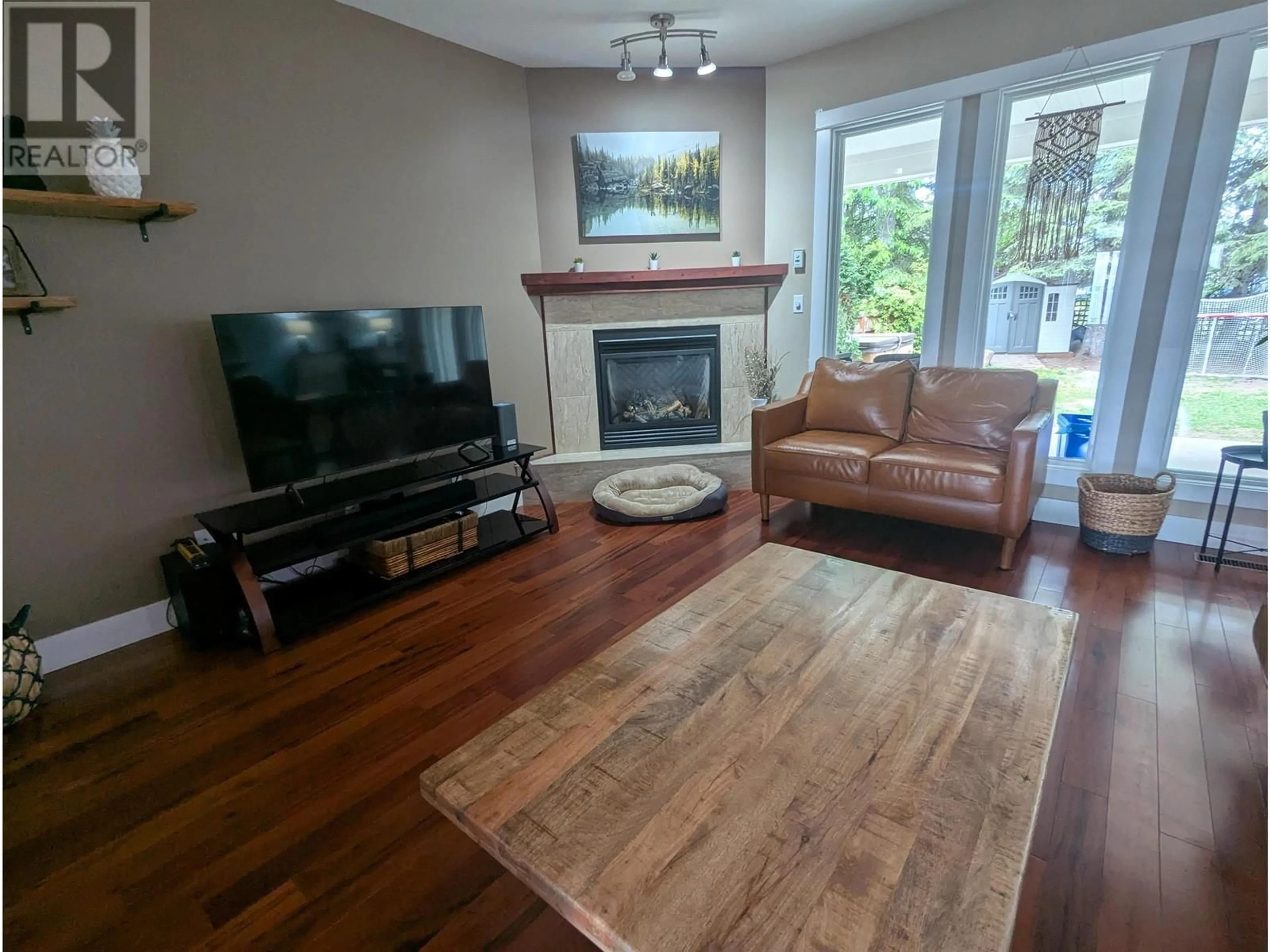 Living room with furniture, wood/laminate floor for 3240 3RD AVENUE, Smithers British Columbia V0J2N0