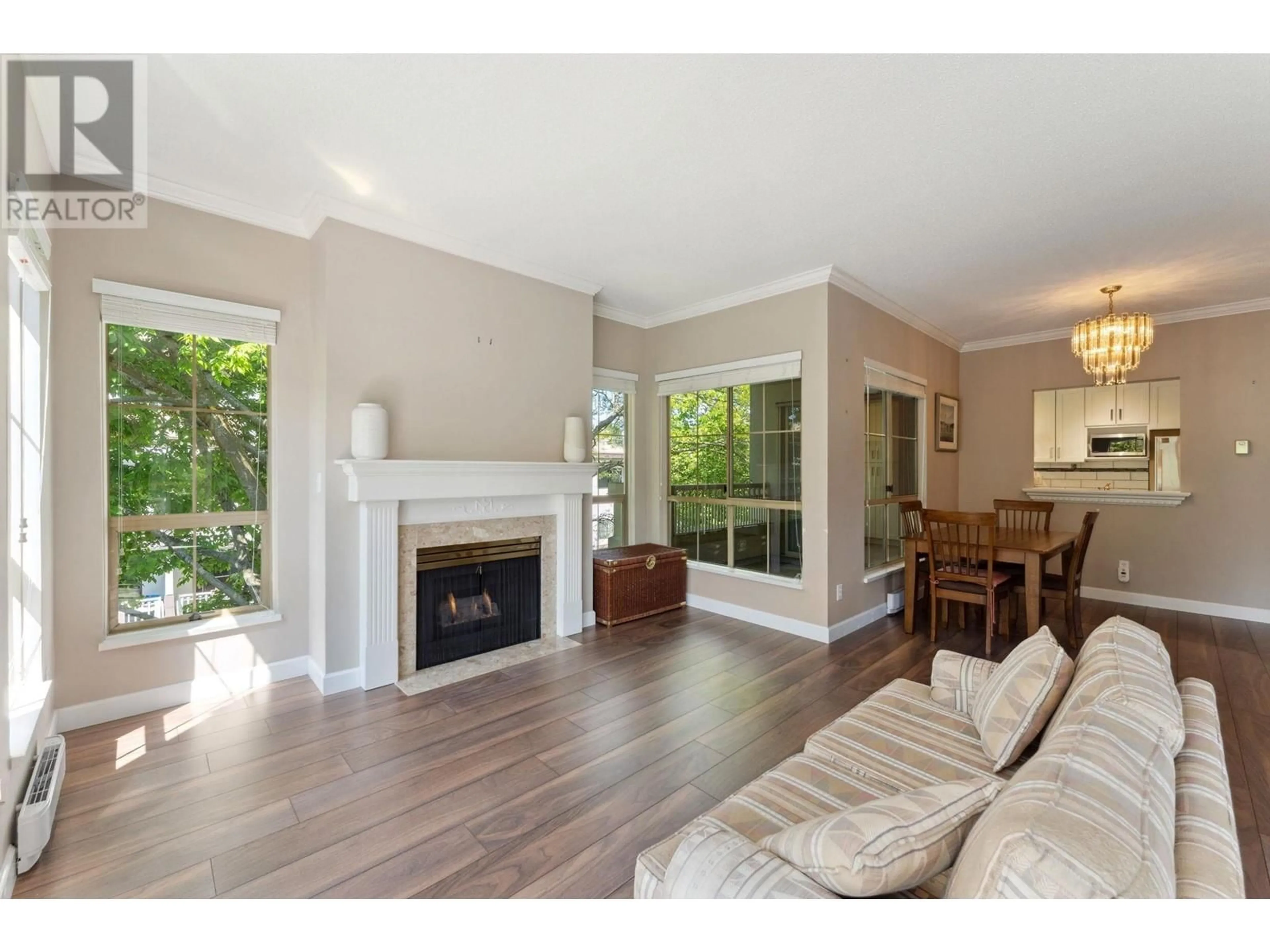 Living room with furniture, wood/laminate floor for 205 - 8500 GENERAL CURRIE ROAD, Richmond British Columbia V6Y3V4