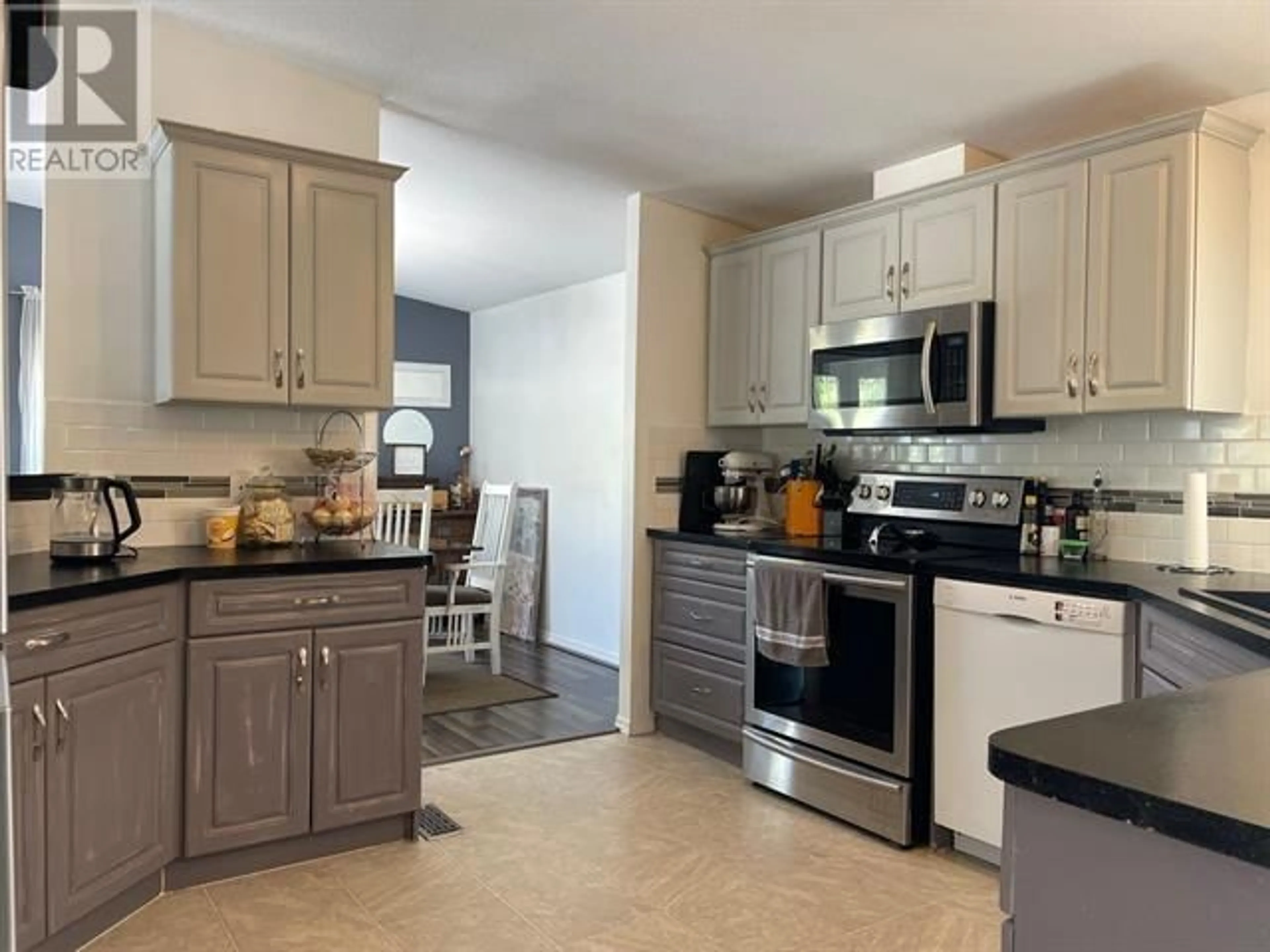 Open concept kitchen, ceramic/tile floor for 166 MCCONACHIE CREEK ROAD, Fort Nelson British Columbia V0C1R0