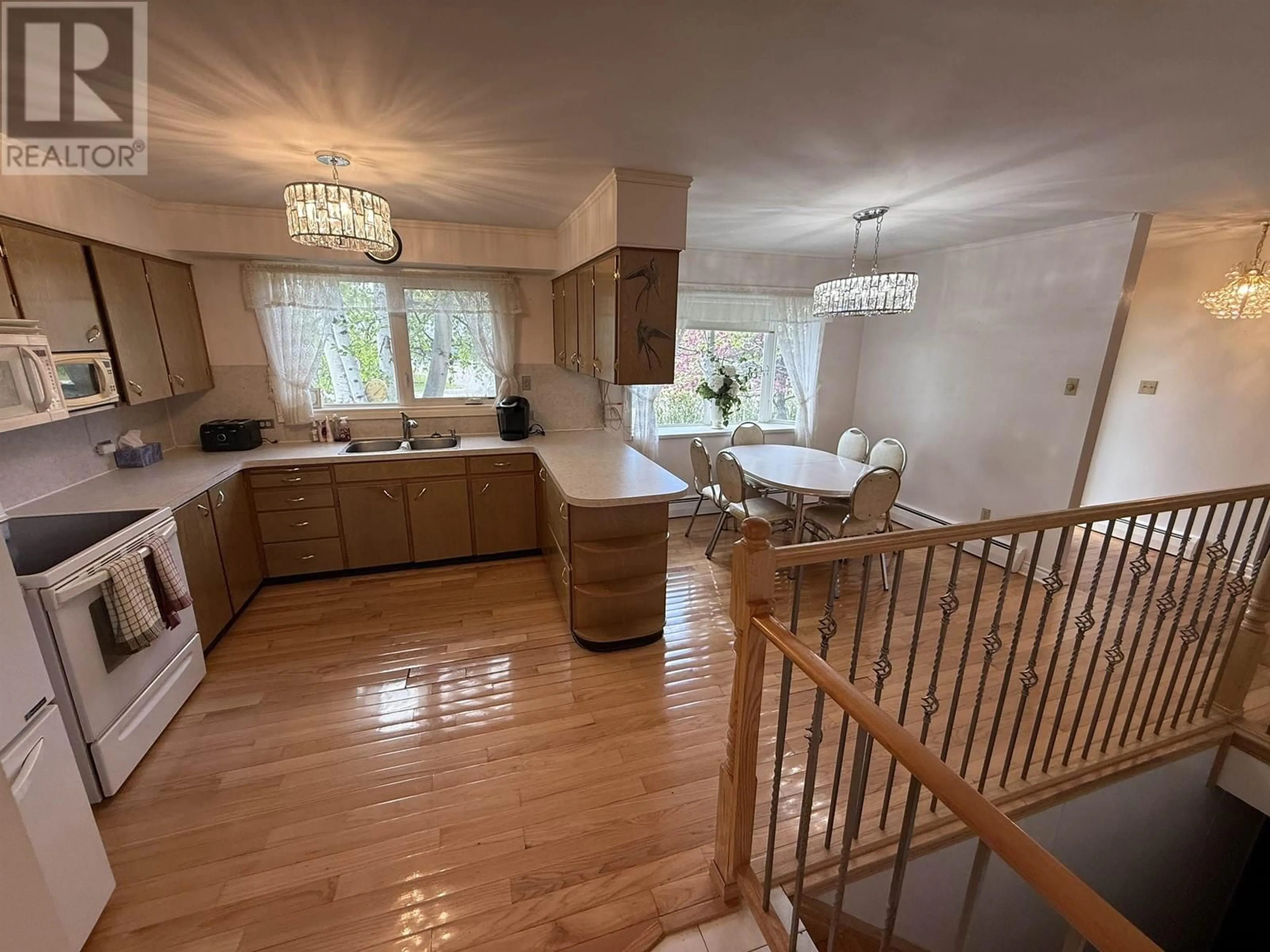 Open concept kitchen, wood/laminate floor for 10108 MACDOUGALL STREET, Hudsons Hope British Columbia V0C1V0