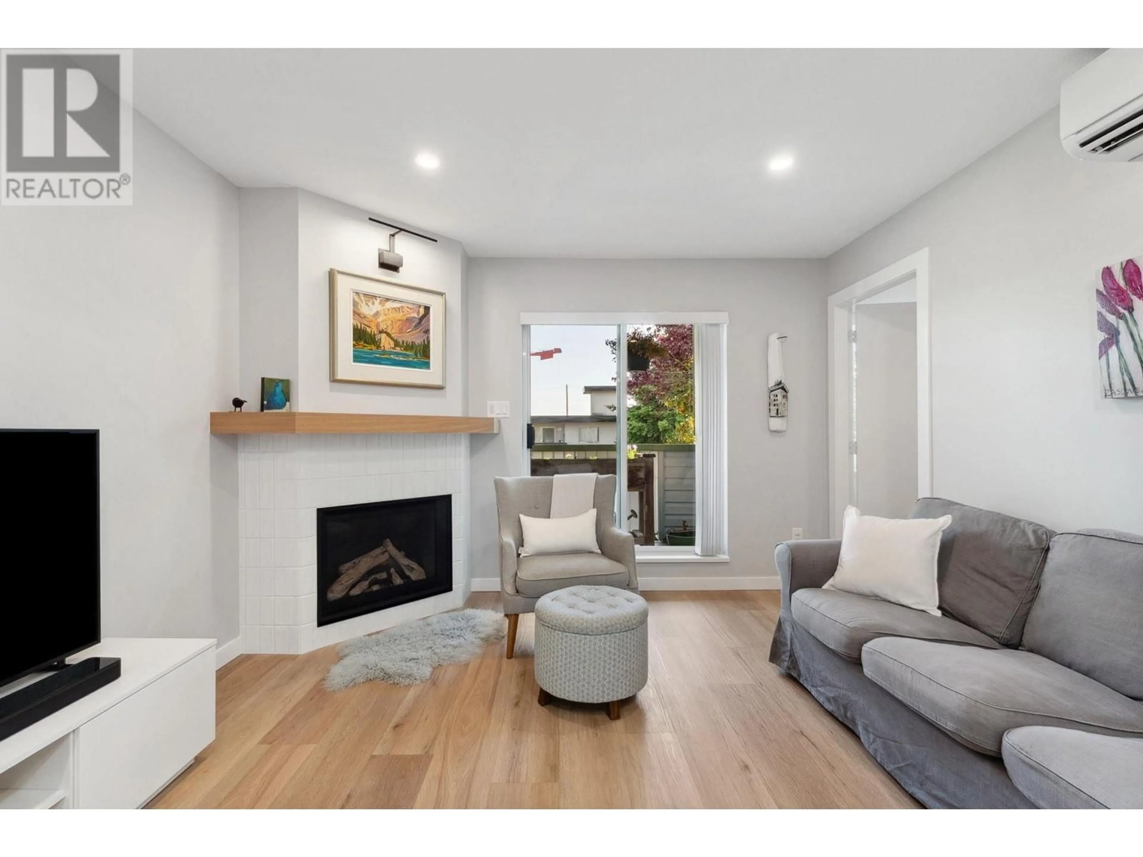 Living room with furniture, wood/laminate floor for 204 - 3861 ALBERT STREET, Burnaby British Columbia V5C2C8