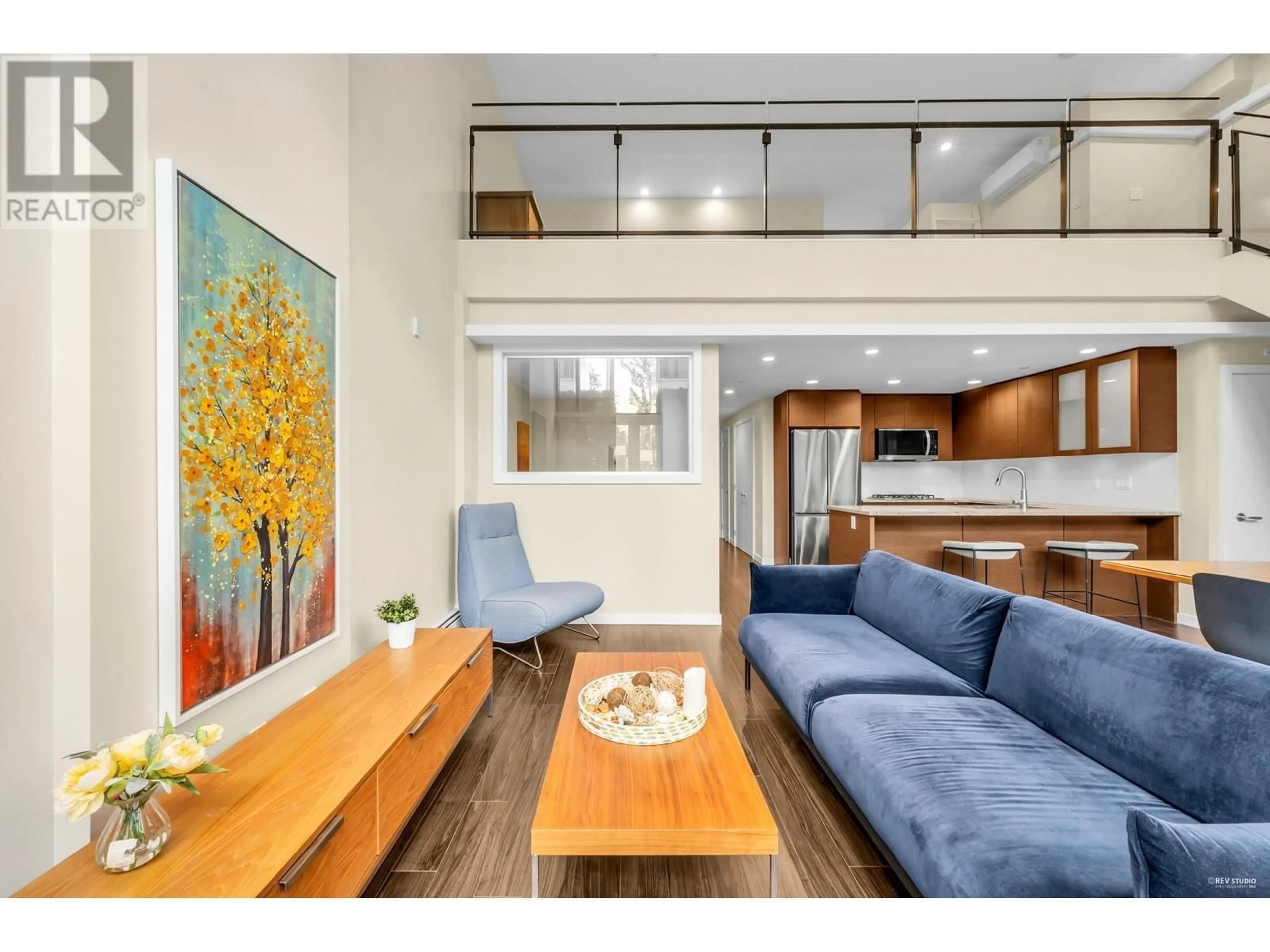 Living room with furniture, wood/laminate floor for 103 - 6311 CAMBIE STREET, Vancouver British Columbia V5Z3B2