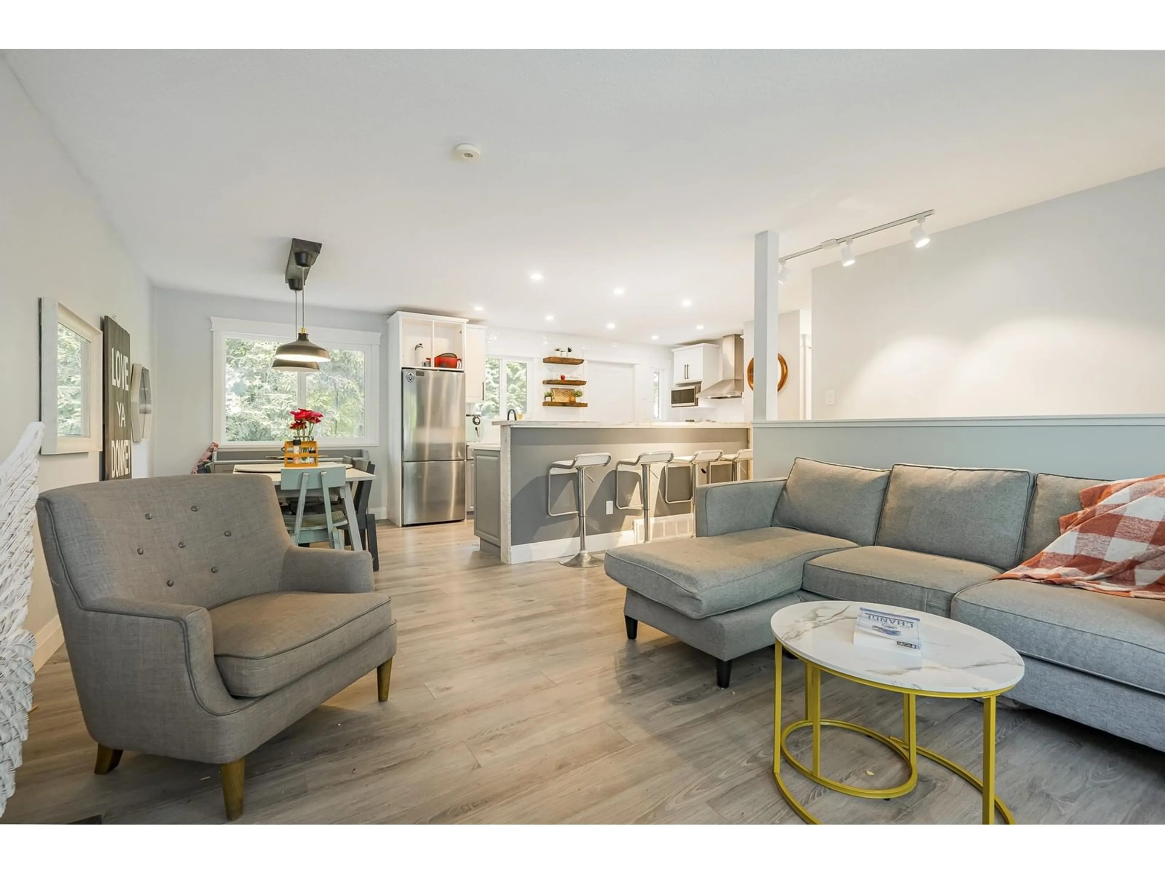 Living room with furniture, wood/laminate floor for 6354 183, Surrey British Columbia V3S8A8