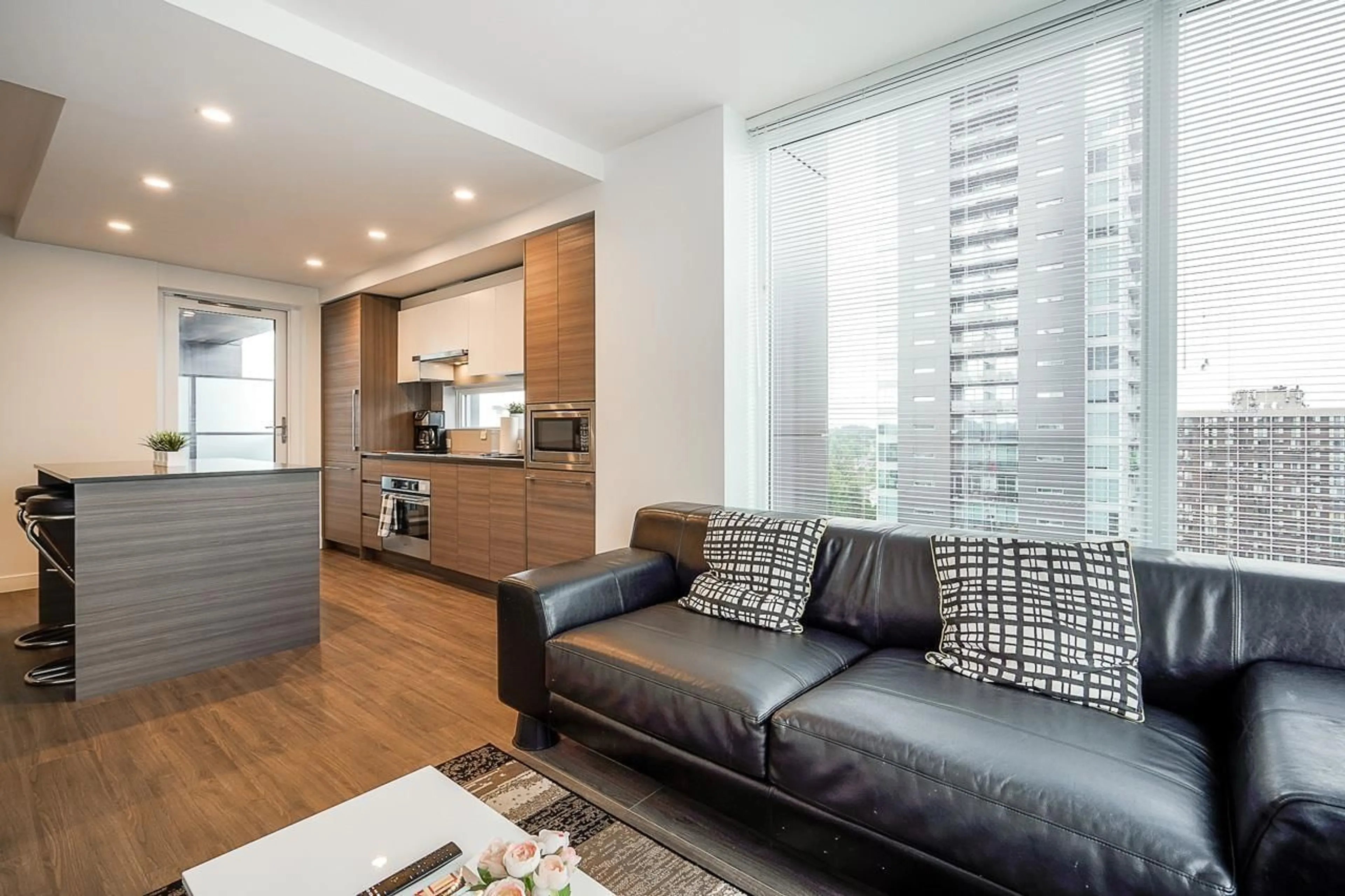 Living room with furniture, wood/laminate floor for 1404 - 13655 FRASER, Surrey British Columbia V3T0P8