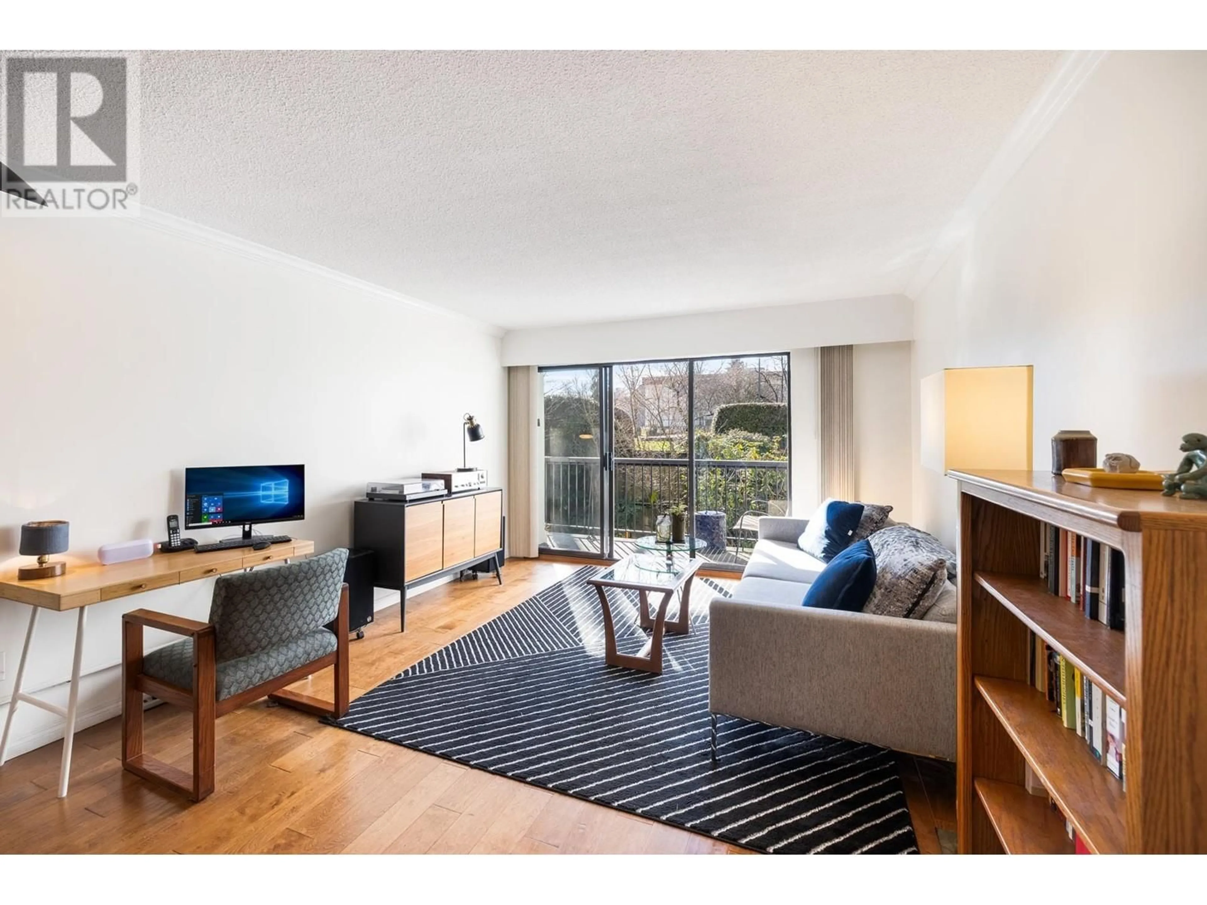Living room with furniture, wood/laminate floor for 207 - 444 6TH AVENUE, Vancouver British Columbia V5T1K6