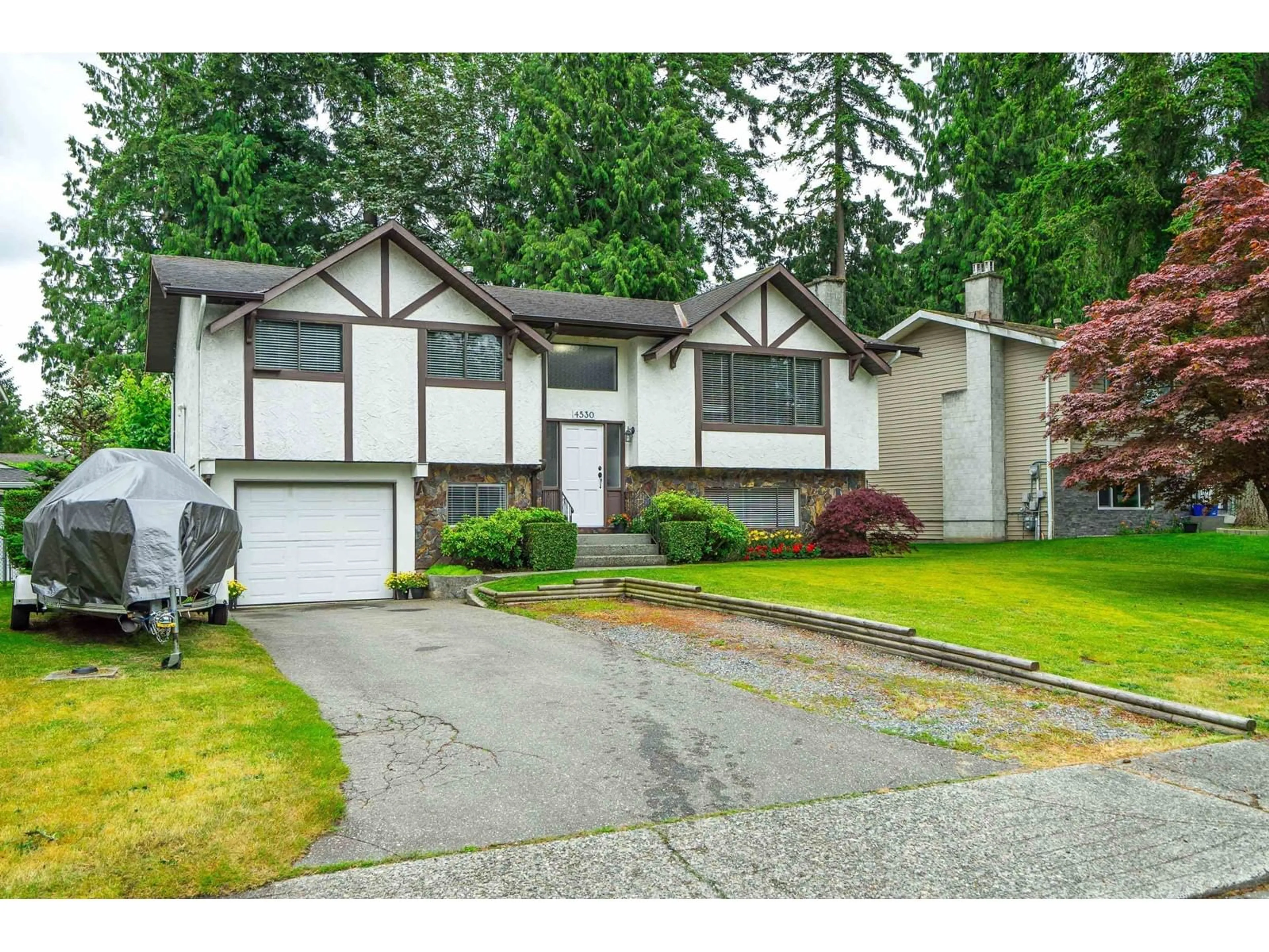 Home with vinyl exterior material, street for 4530 202, Langley British Columbia V3A6M7