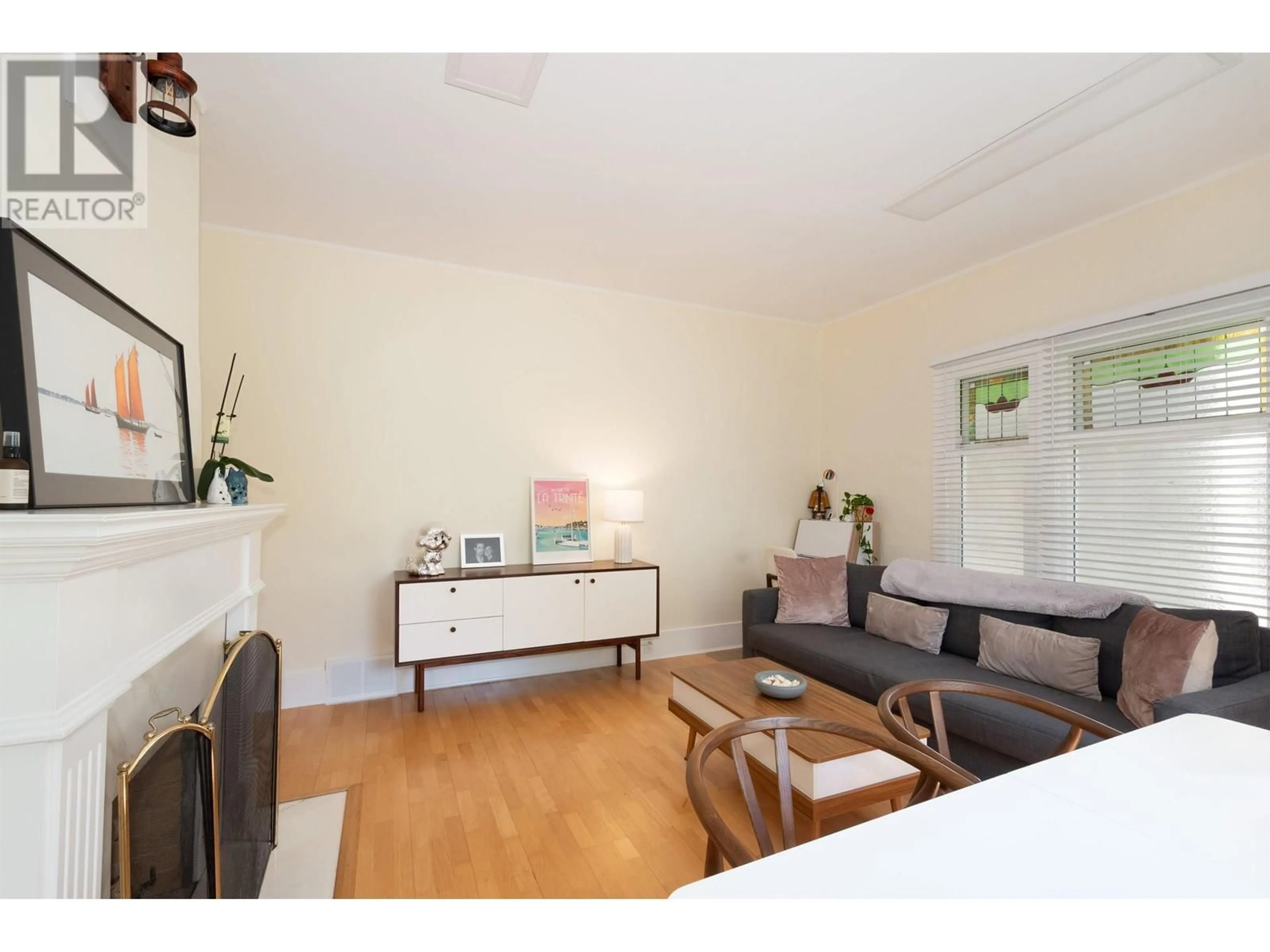 Living room with furniture, wood/laminate floor for 3652 POINT GREY ROAD, Vancouver British Columbia V6R1A9