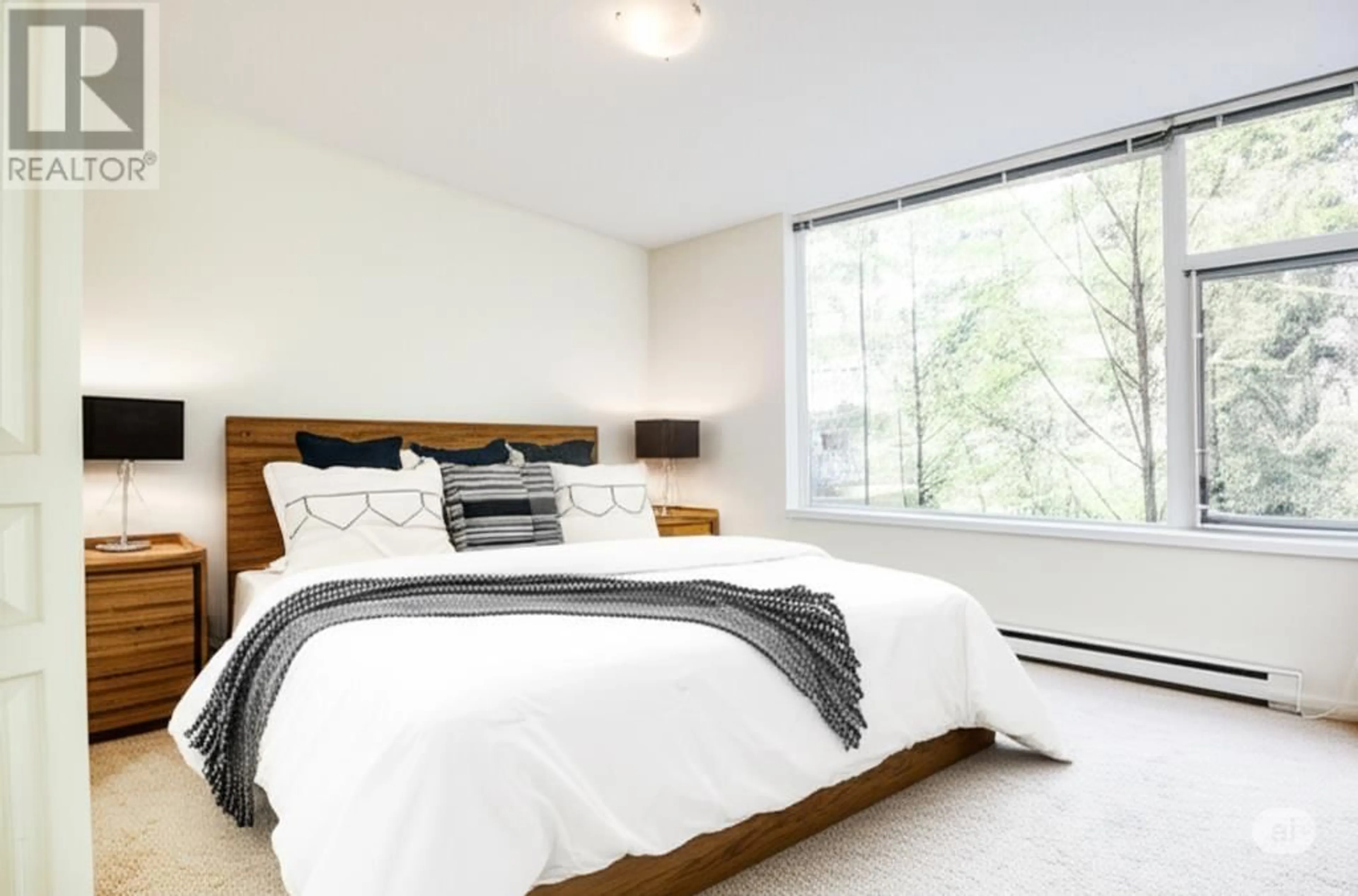 Bedroom with bed, wood/laminate floor for 004 - 9288 UNIVERSITY CRESCENT, Burnaby British Columbia V5A4X7