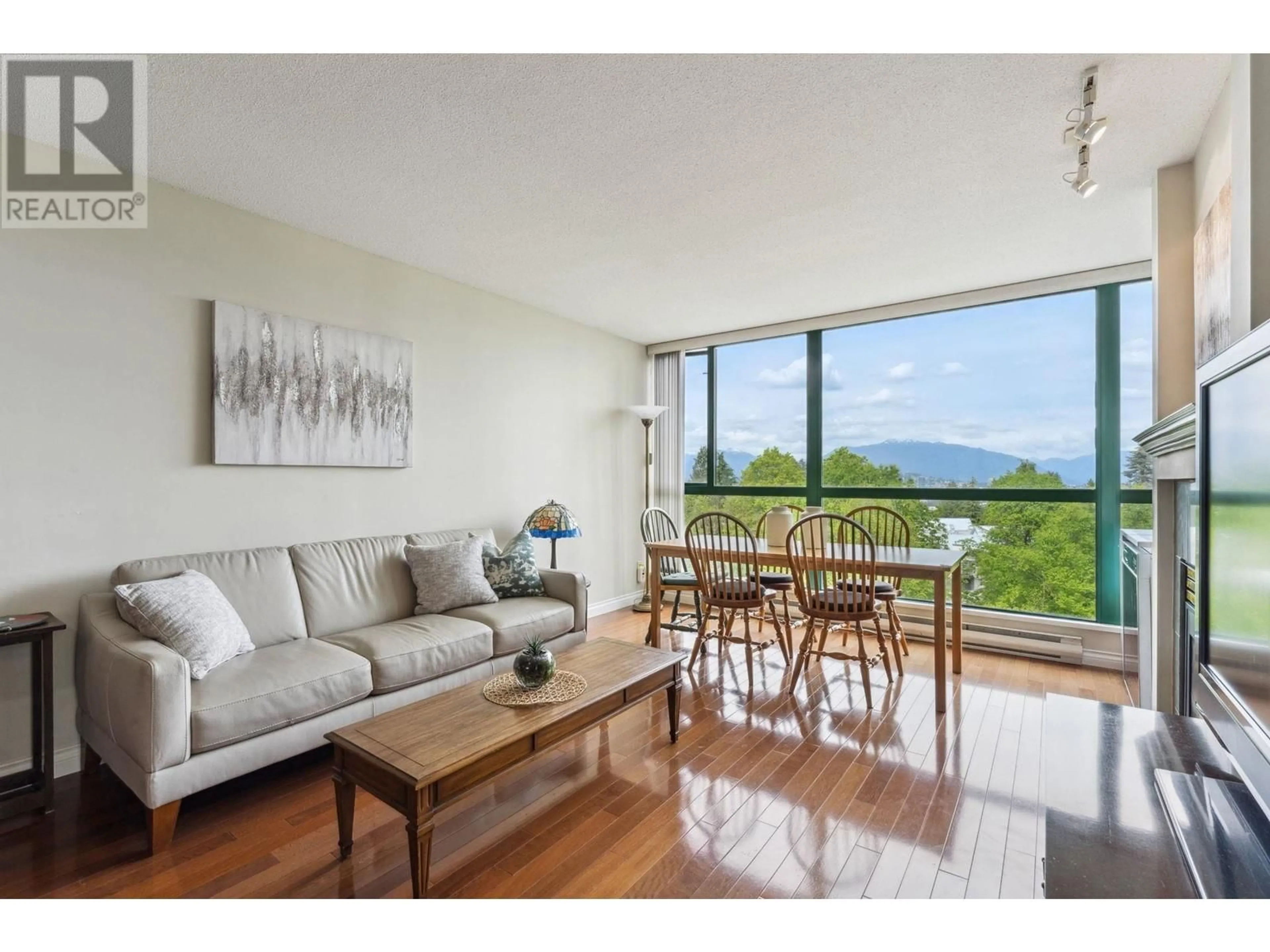 Living room with furniture, wood/laminate floor for 602 - 5899 WILSON AVENUE, Burnaby British Columbia V5H4R9