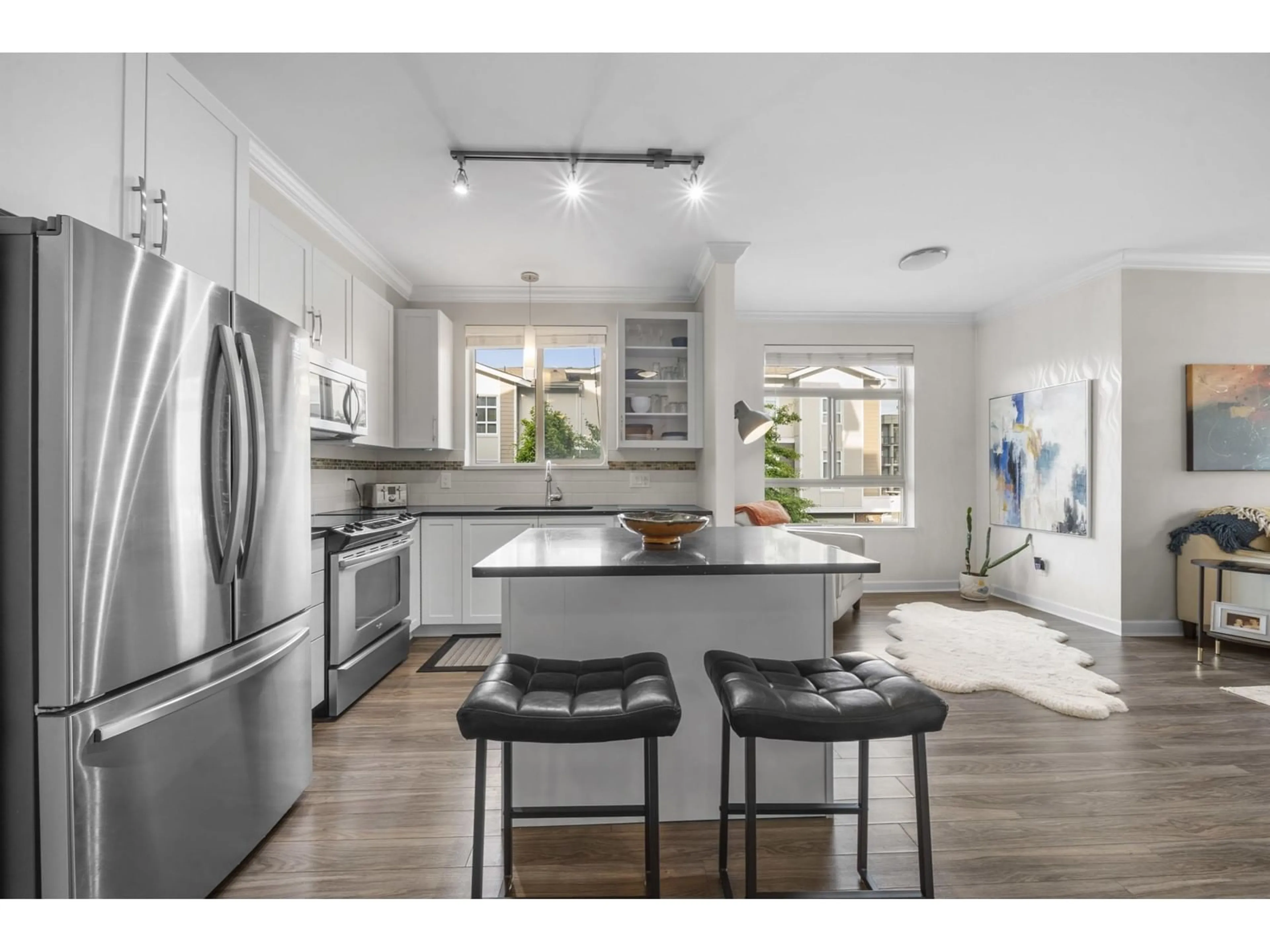 Open concept kitchen, ceramic/tile floor for 201 - 20861 83, Langley British Columbia V2Y0M8