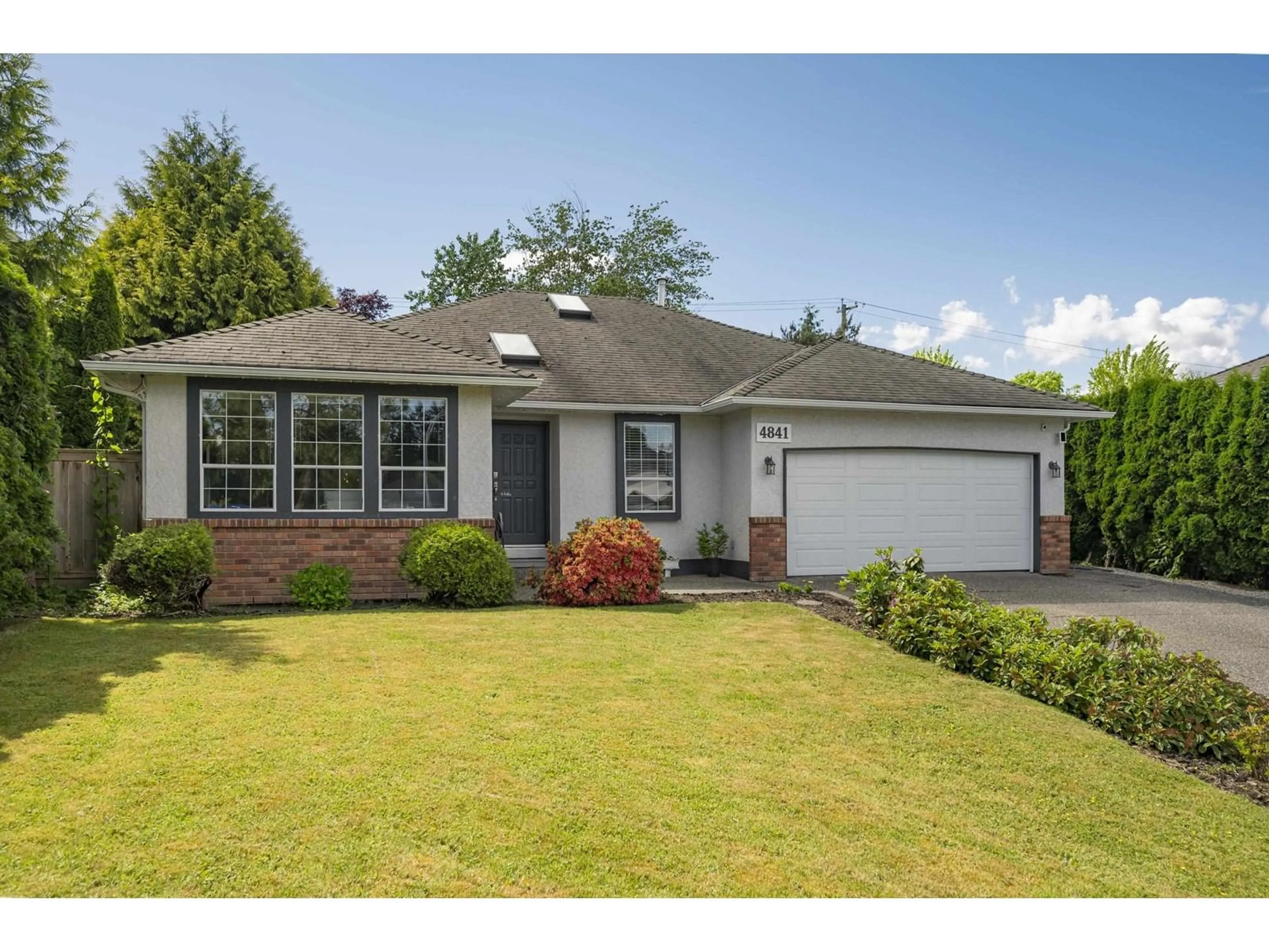 Home with vinyl exterior material, street for 4841 208A, Langley British Columbia V3A5X9