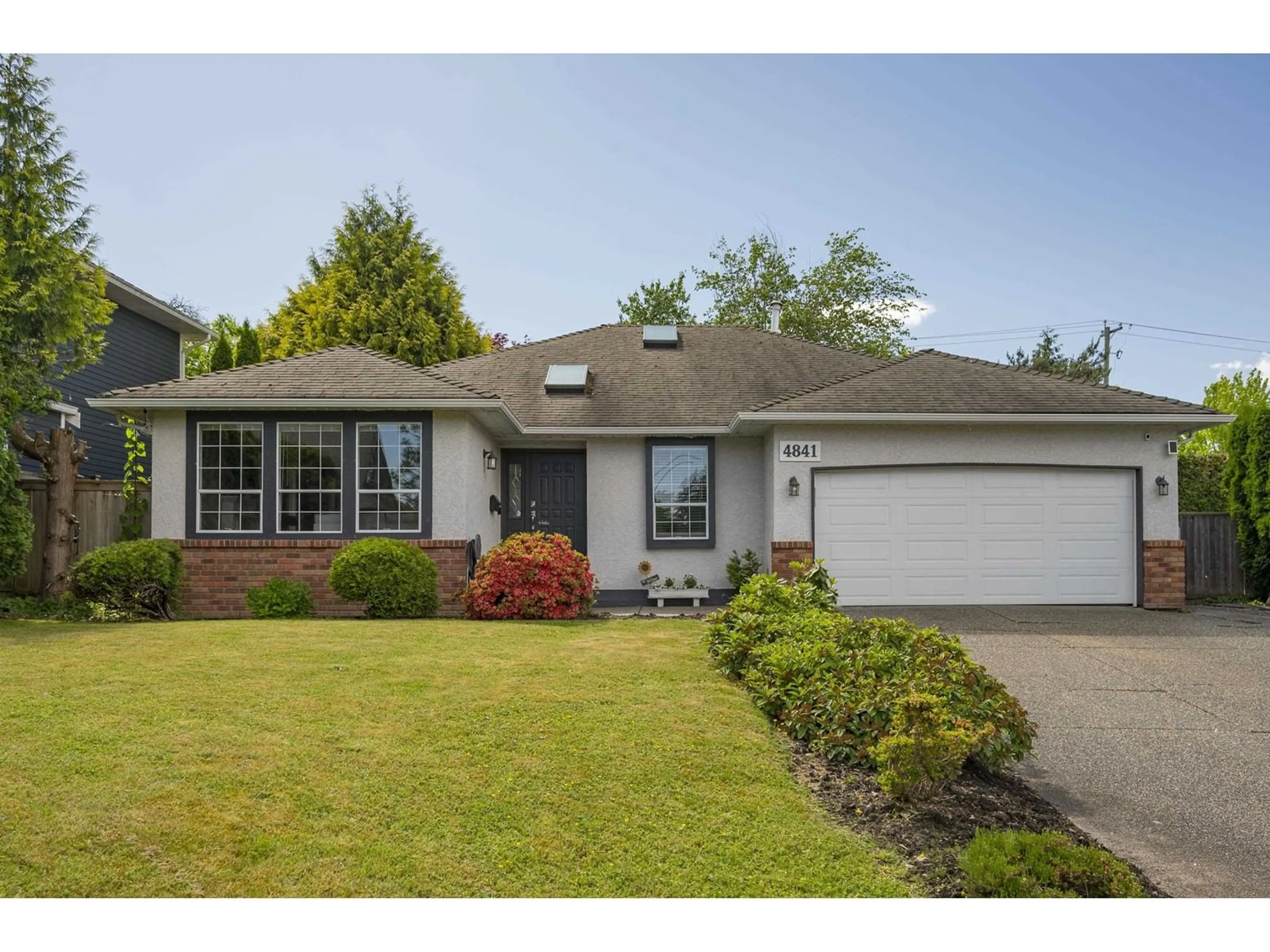 Home with vinyl exterior material, street for 4841 208A, Langley British Columbia V3A5X9