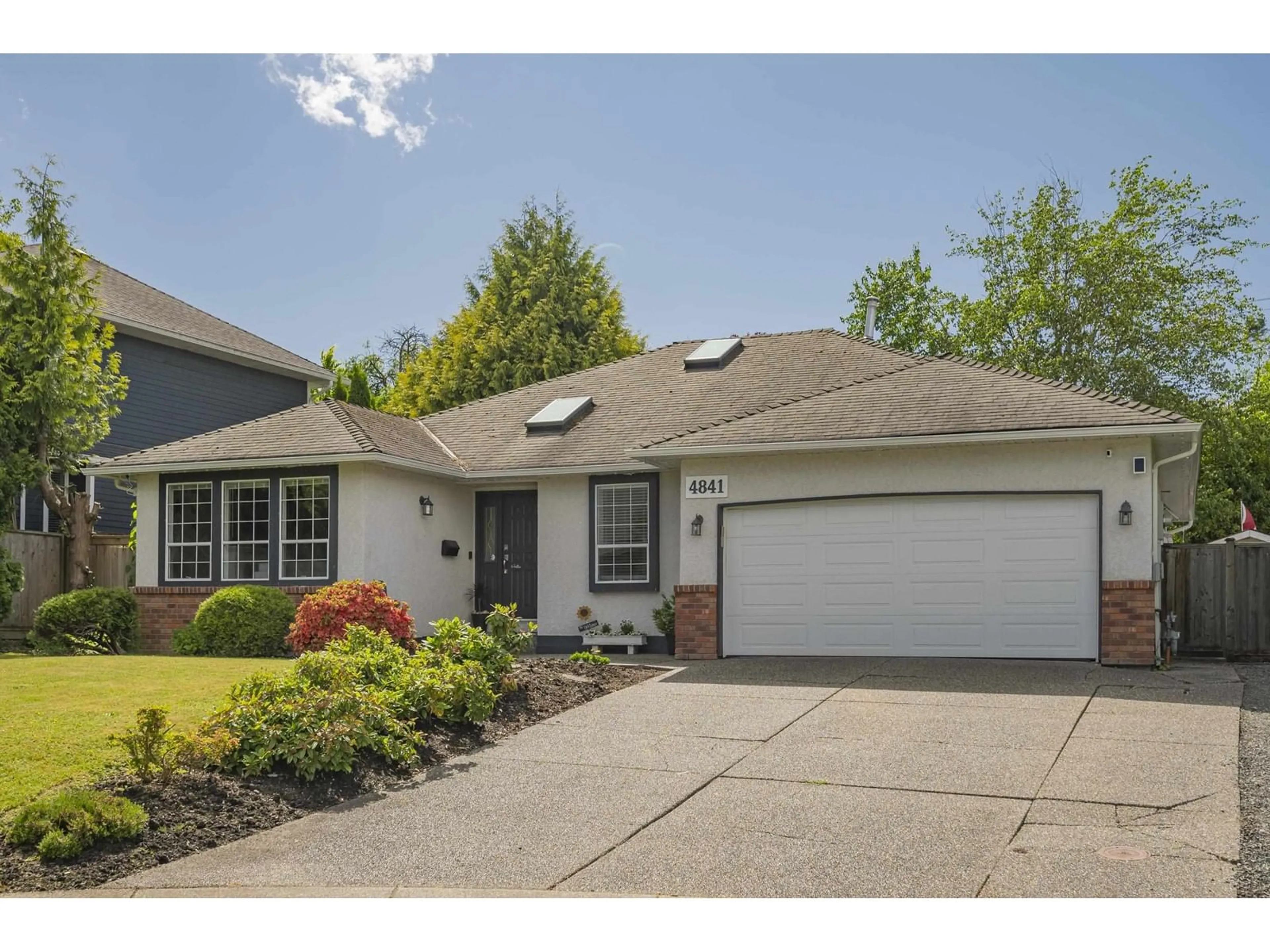 Home with vinyl exterior material, street for 4841 208A, Langley British Columbia V3A5X9