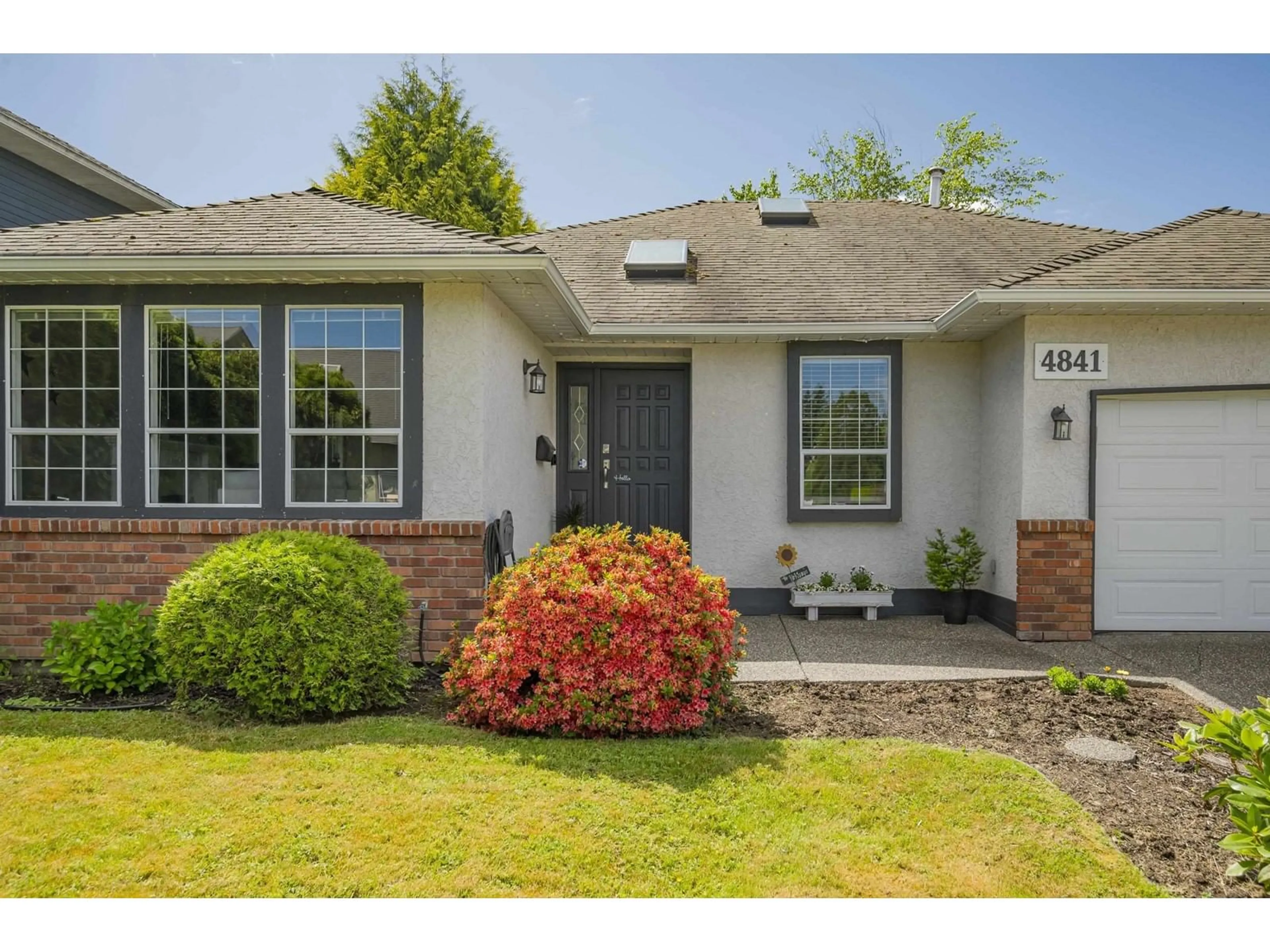 Home with vinyl exterior material, street for 4841 208A, Langley British Columbia V3A5X9