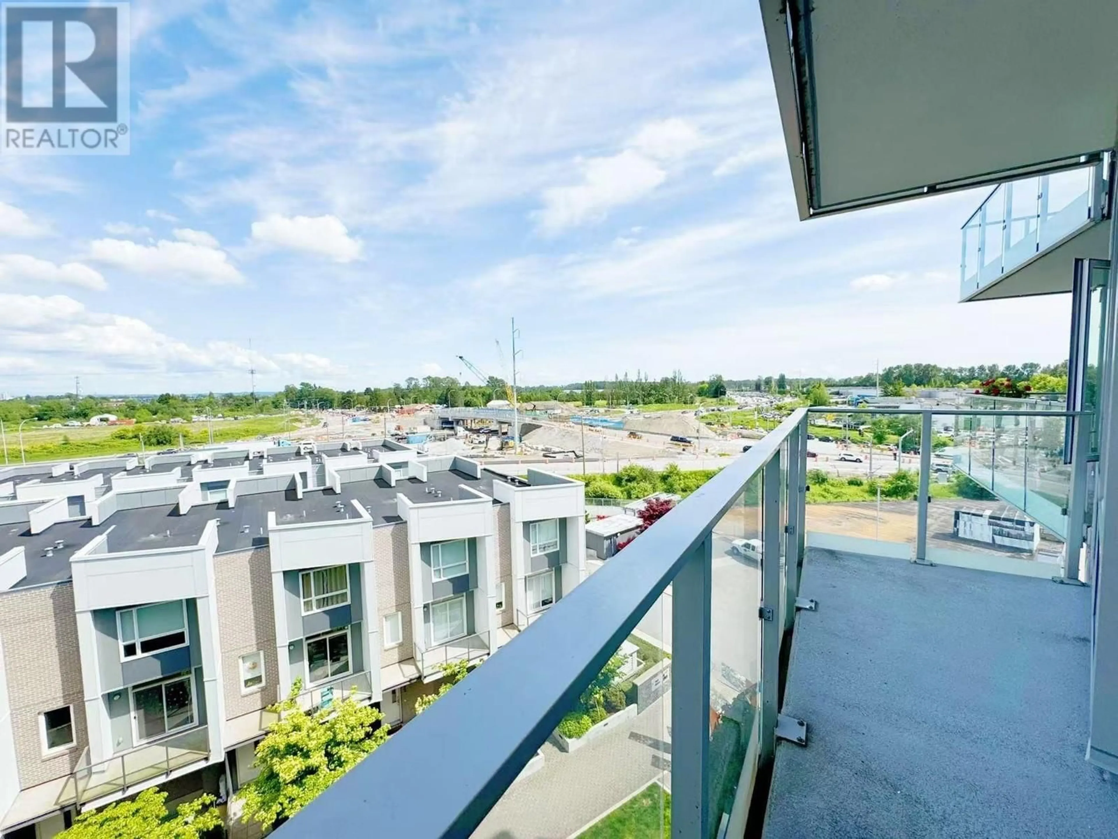 Balcony in the apartment, city buildings view from balcony for 711 - 10788 NO. 5 ROAD, Richmond British Columbia V6W0B7