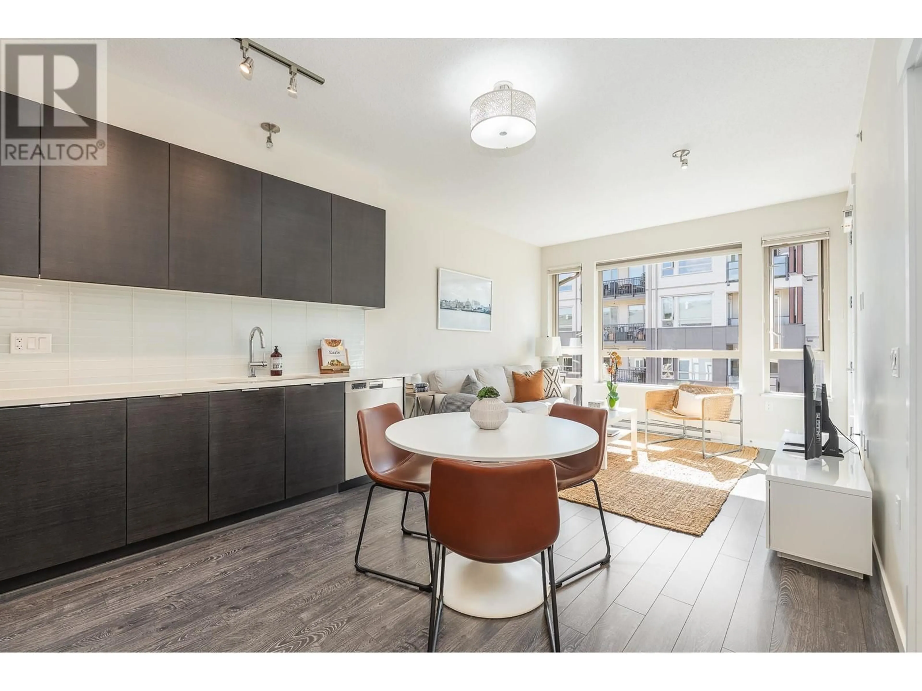 Open concept kitchen, wood/laminate floor for 517 - 2665 MOUNTAIN HIGHWAY, North Vancouver British Columbia V7J0A8