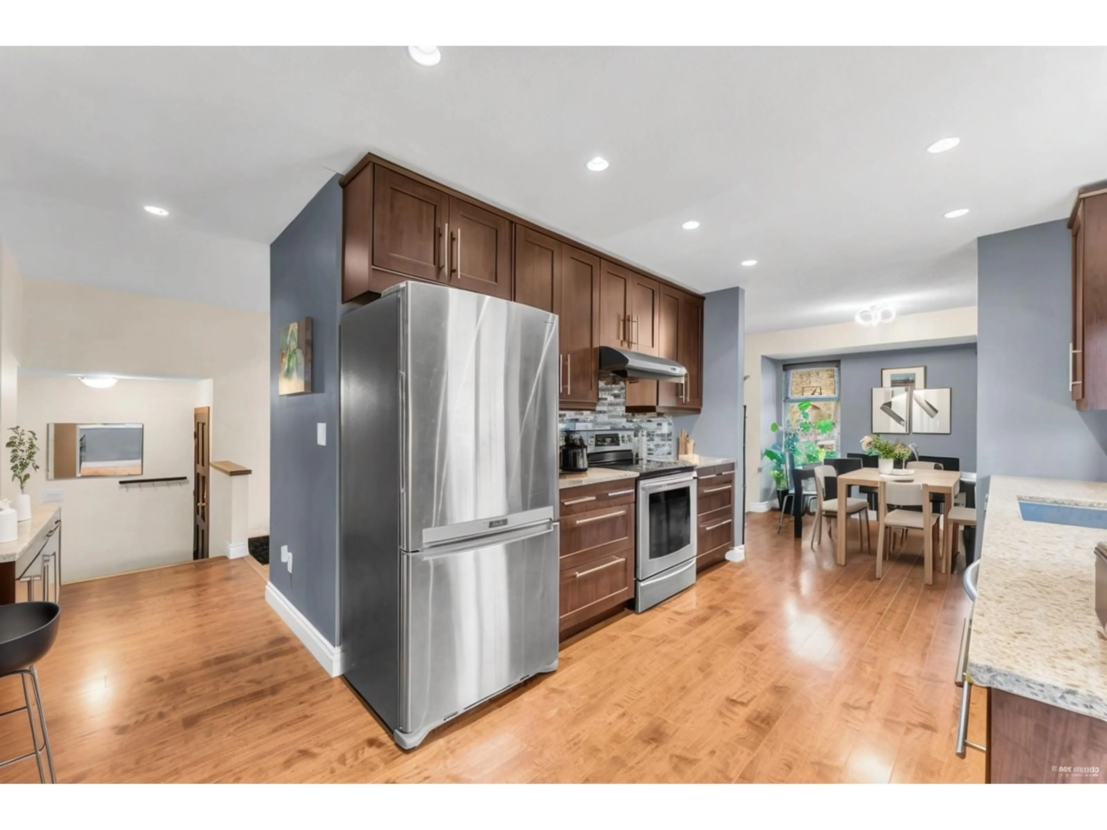 Open concept kitchen, wood/laminate floor for 12966 61B, Surrey British Columbia V3X3G5