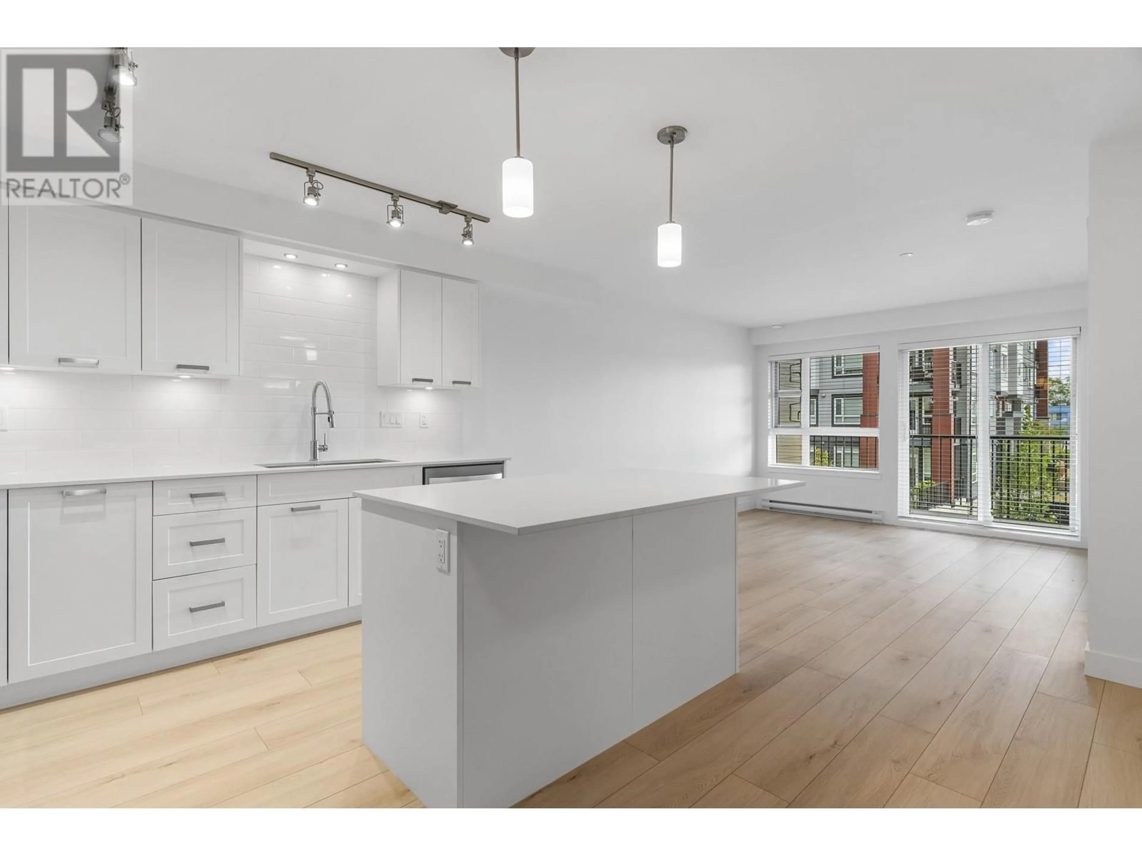 Open concept kitchen, wood/laminate floor for 208 - 22562 121 AVENUE, Maple Ridge British Columbia V2X3Y8