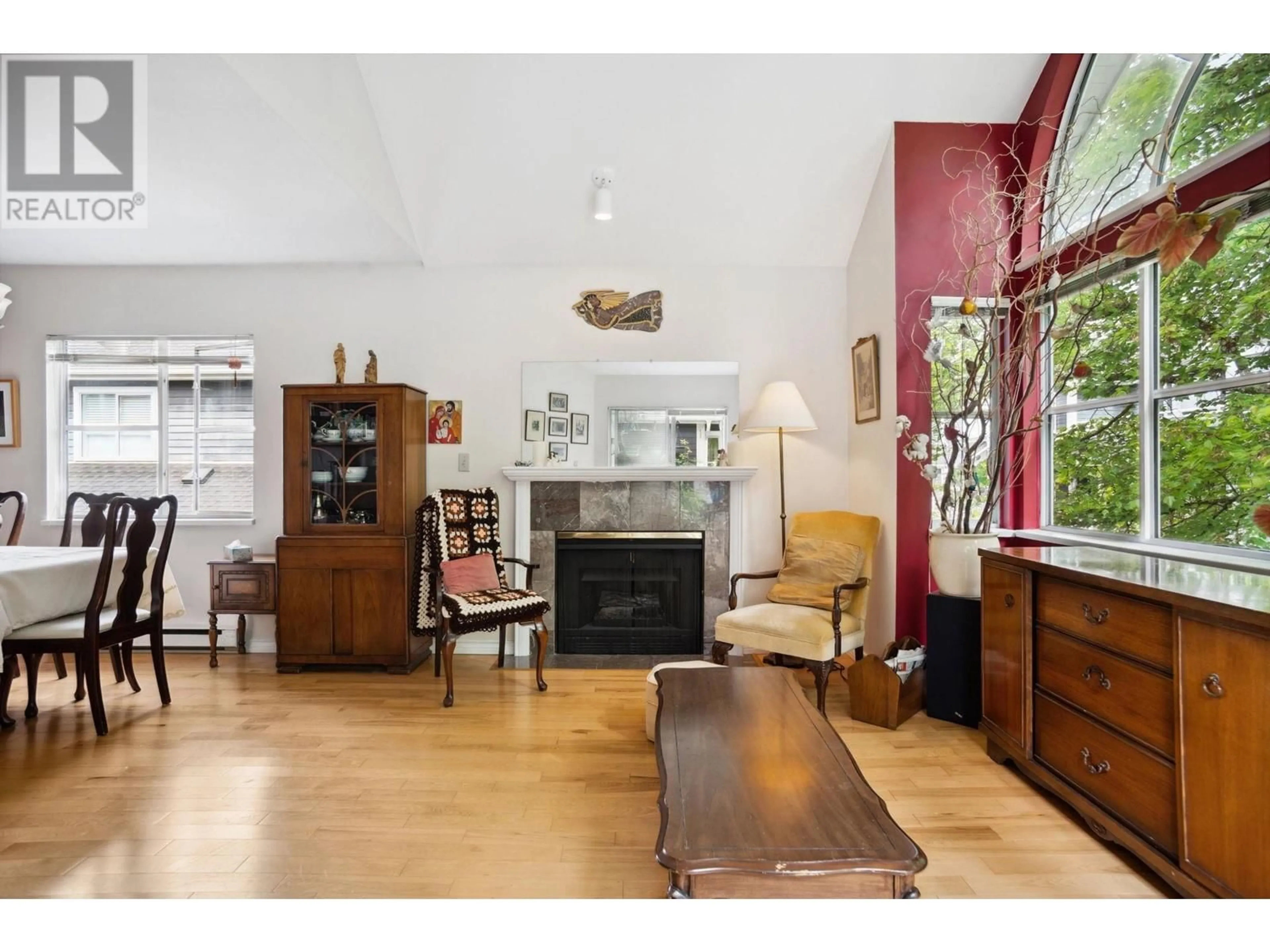 Living room with furniture, wood/laminate floor for 217 - 2960 29TH AVENUE, Vancouver British Columbia V5R5Z5
