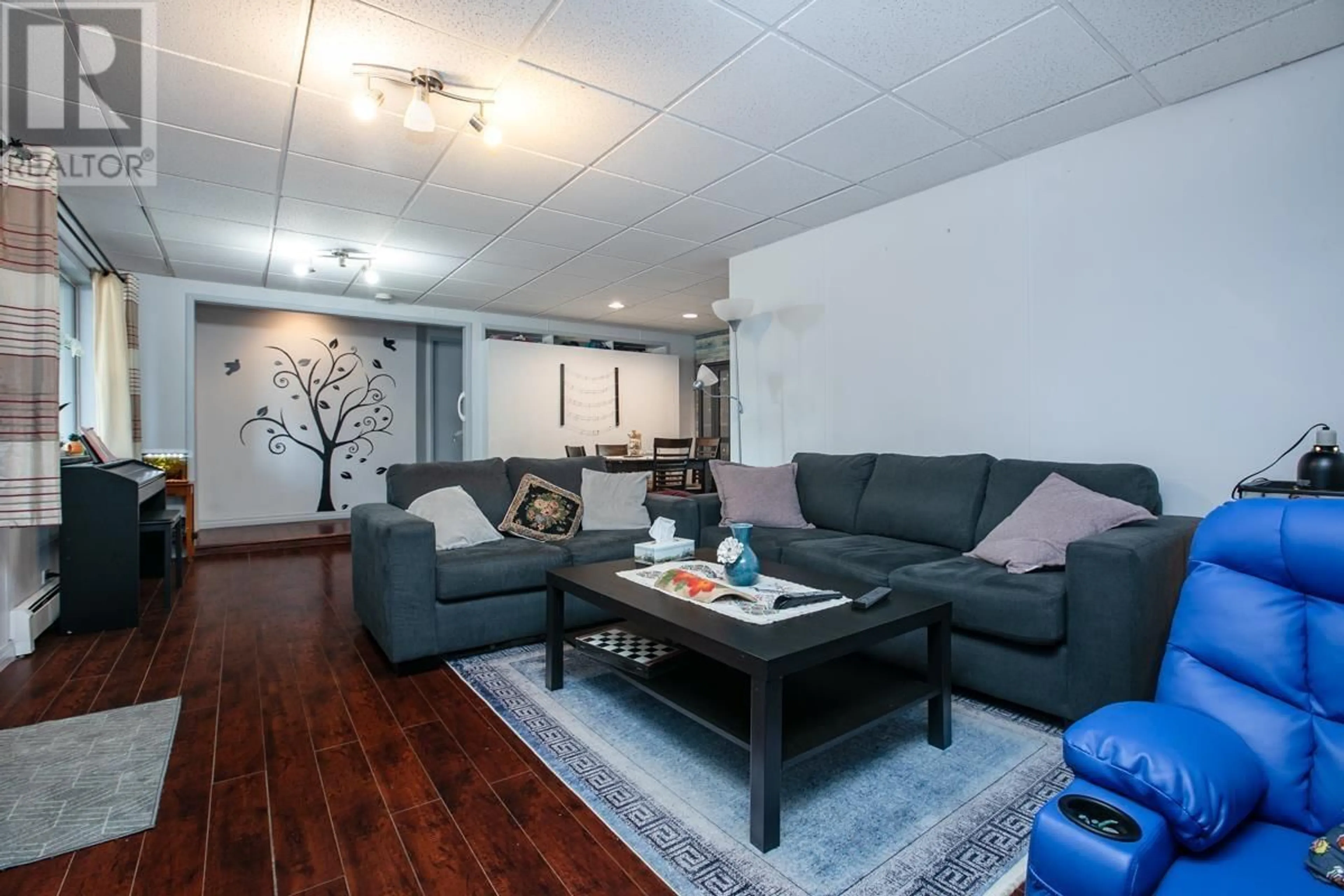 Living room with furniture, wood/laminate floor for 2135 NEWPORT AVENUE, Vancouver British Columbia V5P2H9