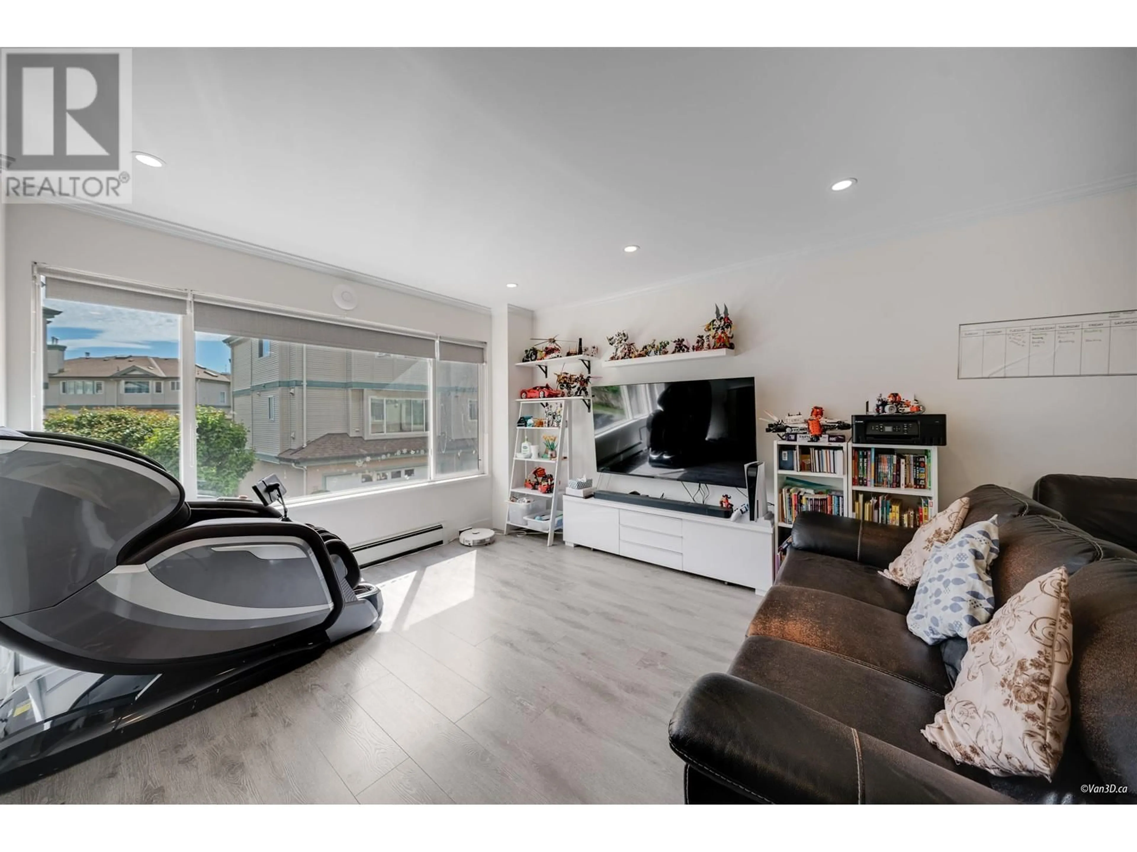 Living room with furniture, wood/laminate floor for 42 - 22800 WINDSOR COURT, Richmond British Columbia V6V2X6