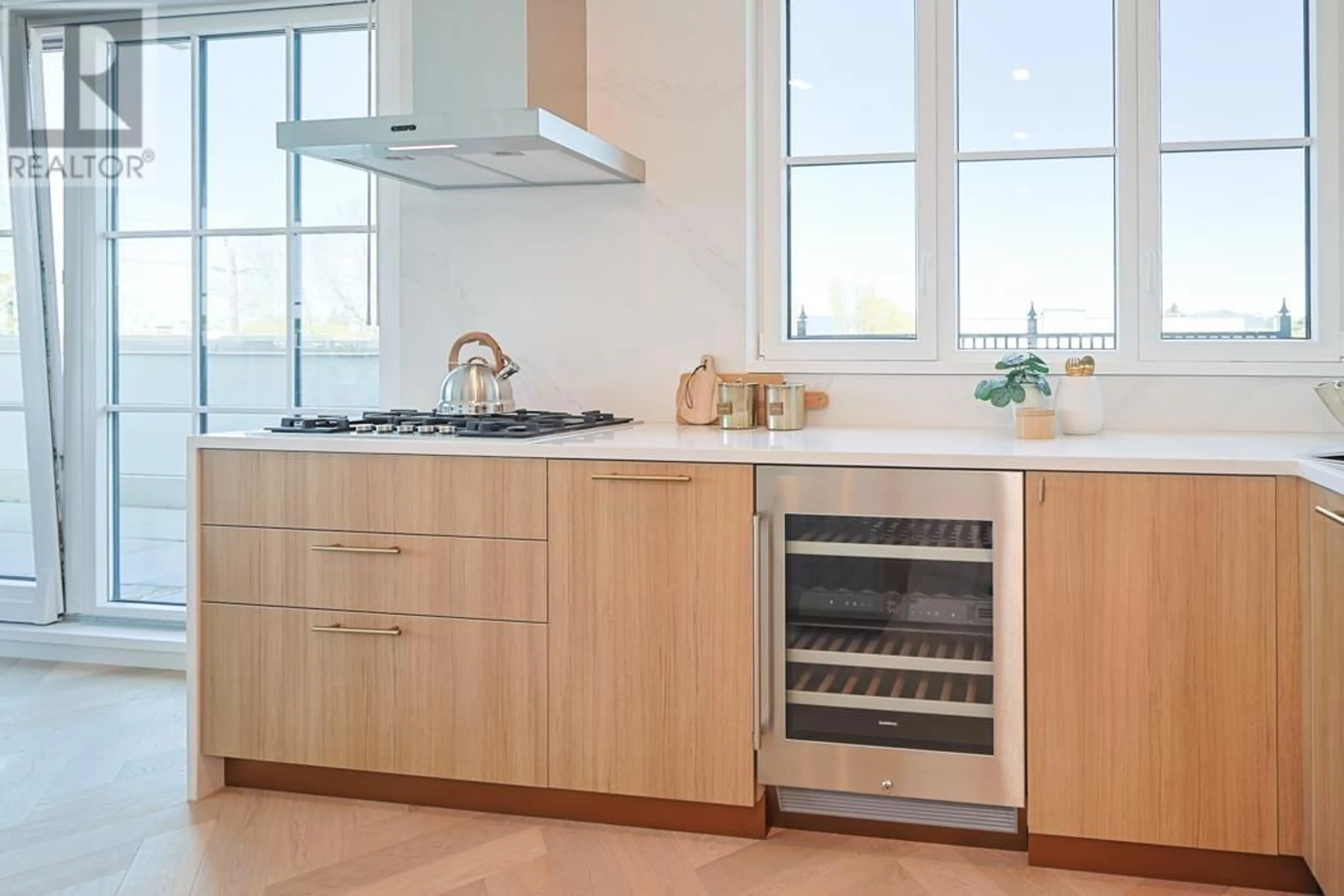 Contemporary kitchen, wood/laminate floor for 410 - 2096 47TH AVENUE, Vancouver British Columbia V6M3W6