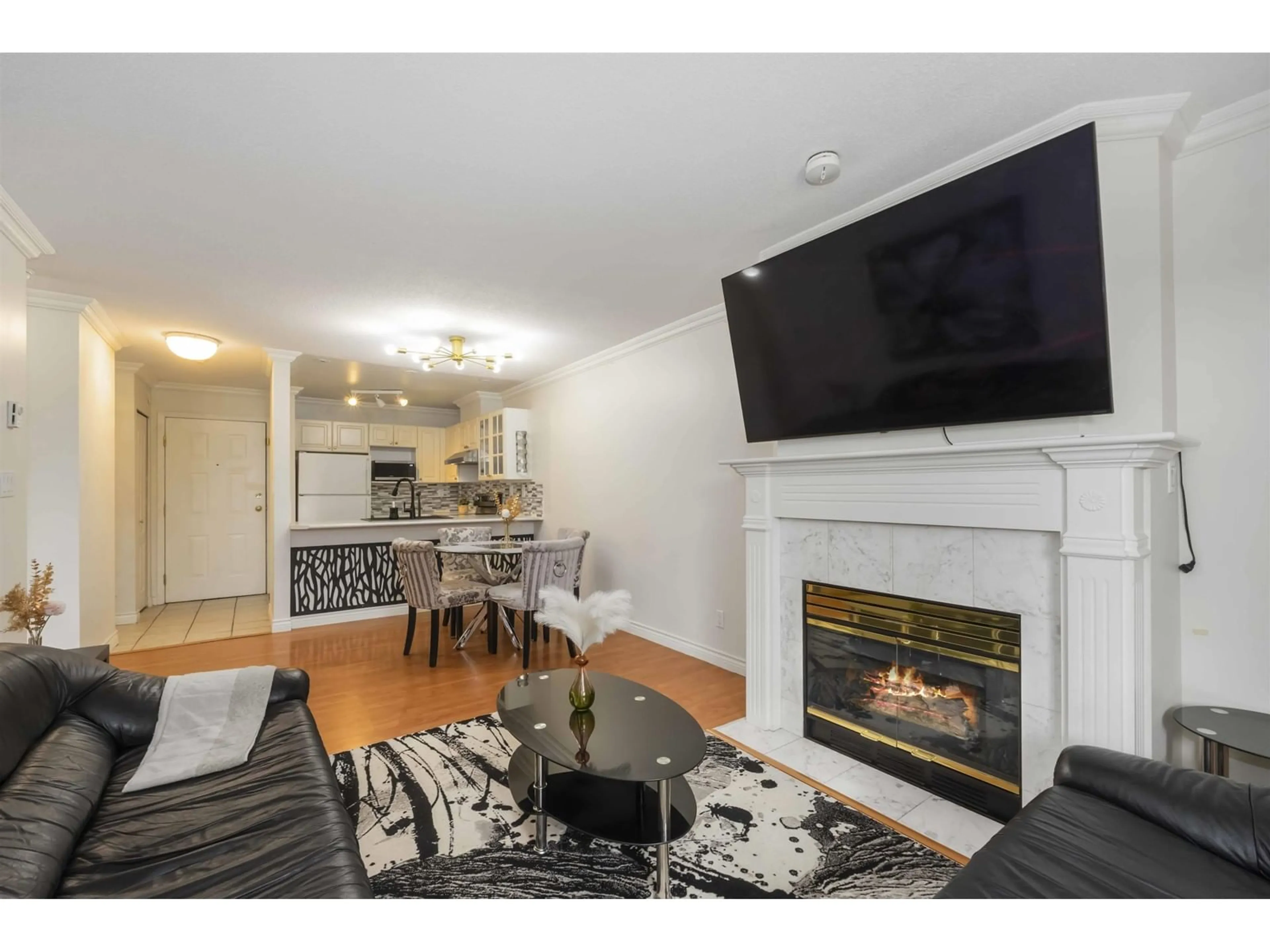 Living room with furniture, wood/laminate floor for 108 - 15150 108, Surrey British Columbia V3R0V1