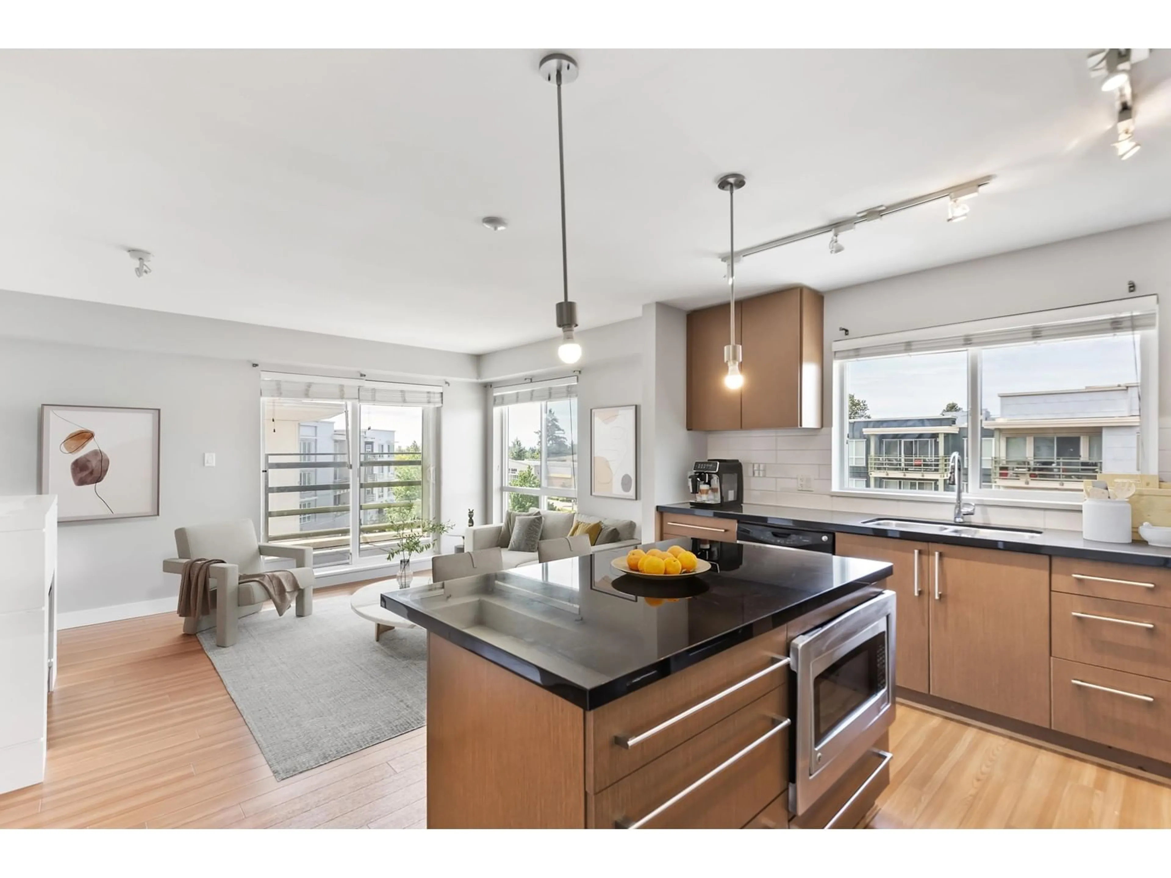 Open concept kitchen, wood/laminate floor for 401 - 15775 CROYDON, Surrey British Columbia V3S2L5