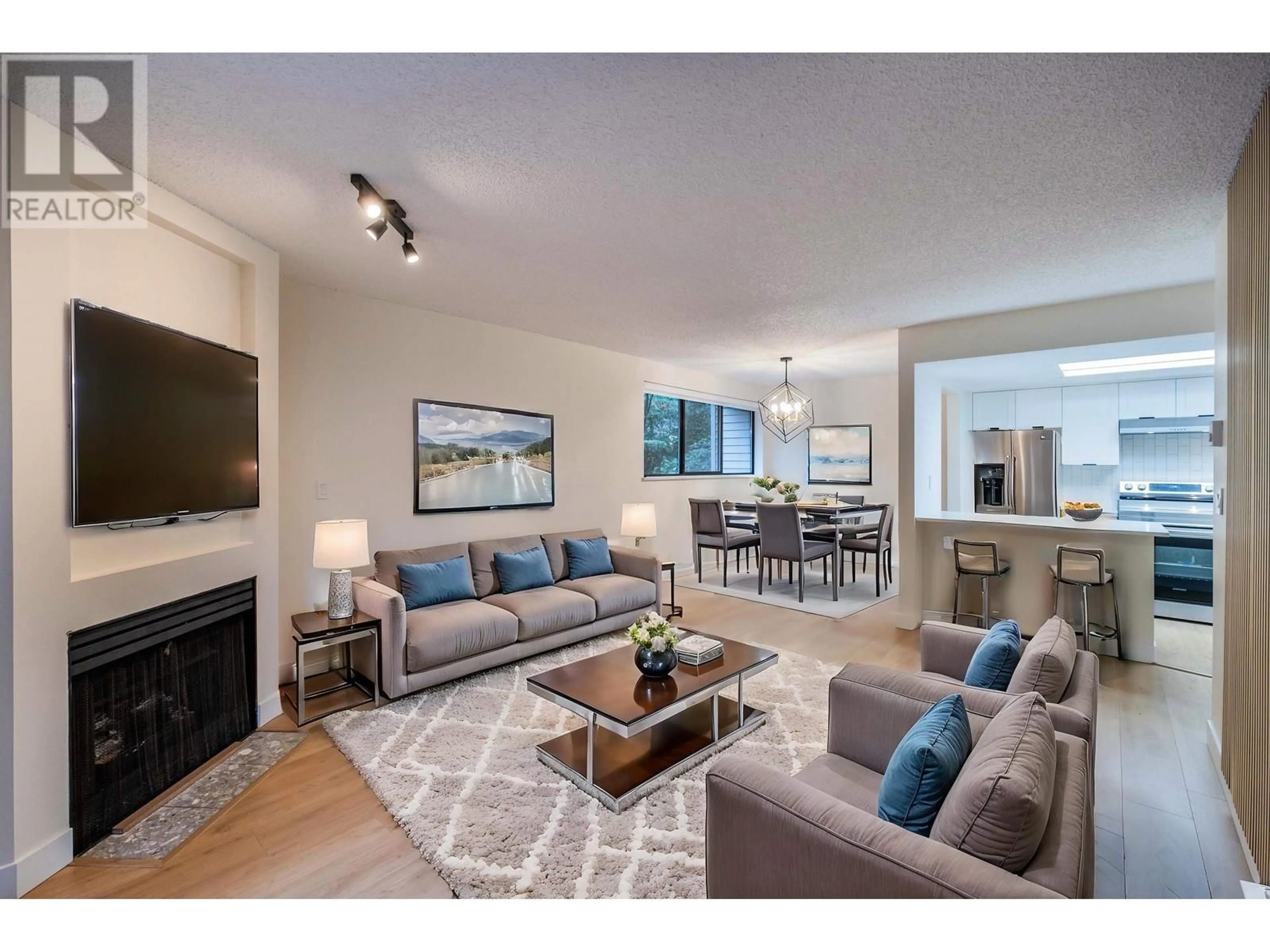 Living room with furniture, unknown for 104 - 2925 GLEN DRIVE, Coquitlam British Columbia V3B7H9