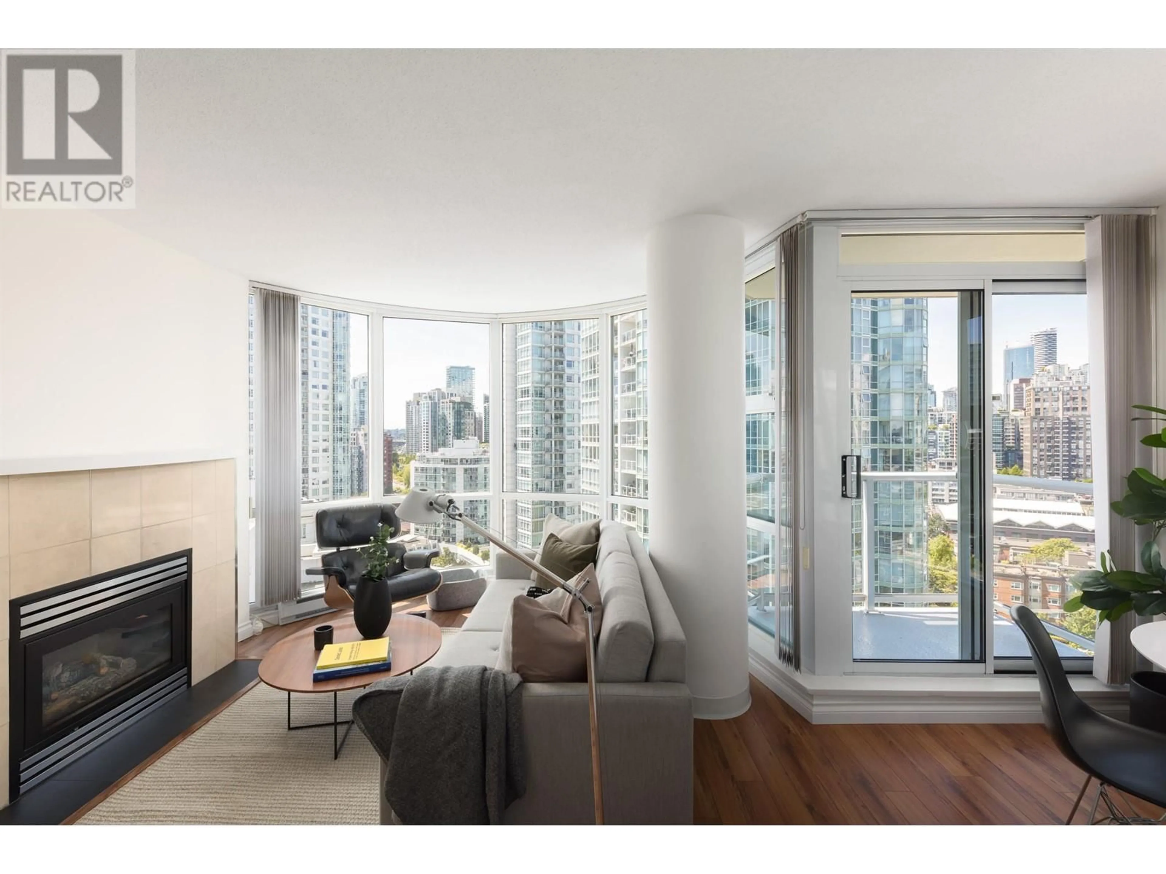Living room with furniture, wood/laminate floor for 2106 - 1077 MARINASIDE CRESCENT, Vancouver British Columbia V6Z2Z5