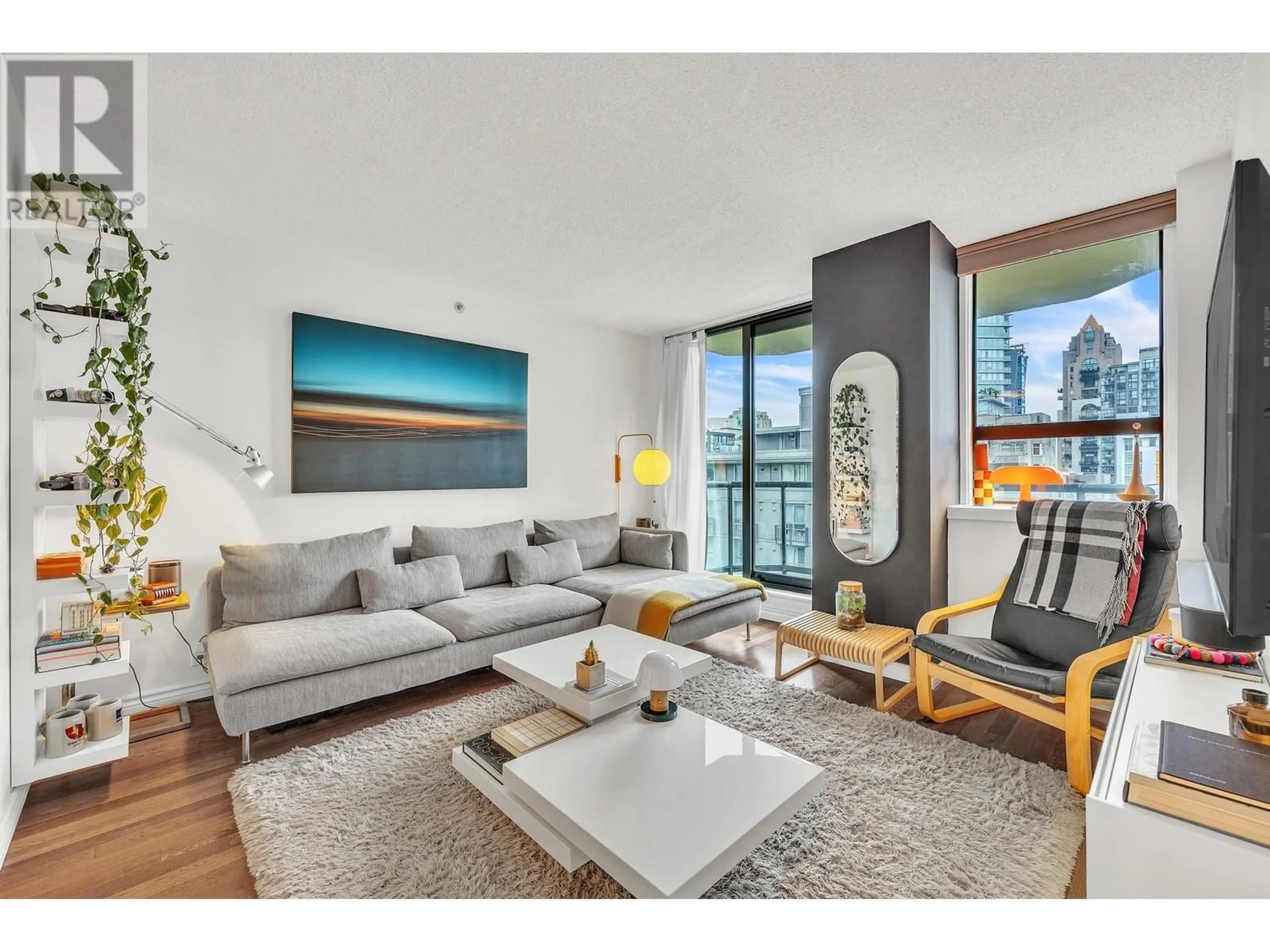 Living room with furniture, wood/laminate floor for 607 - 789 DRAKE STREET, Vancouver British Columbia V6Z2N7