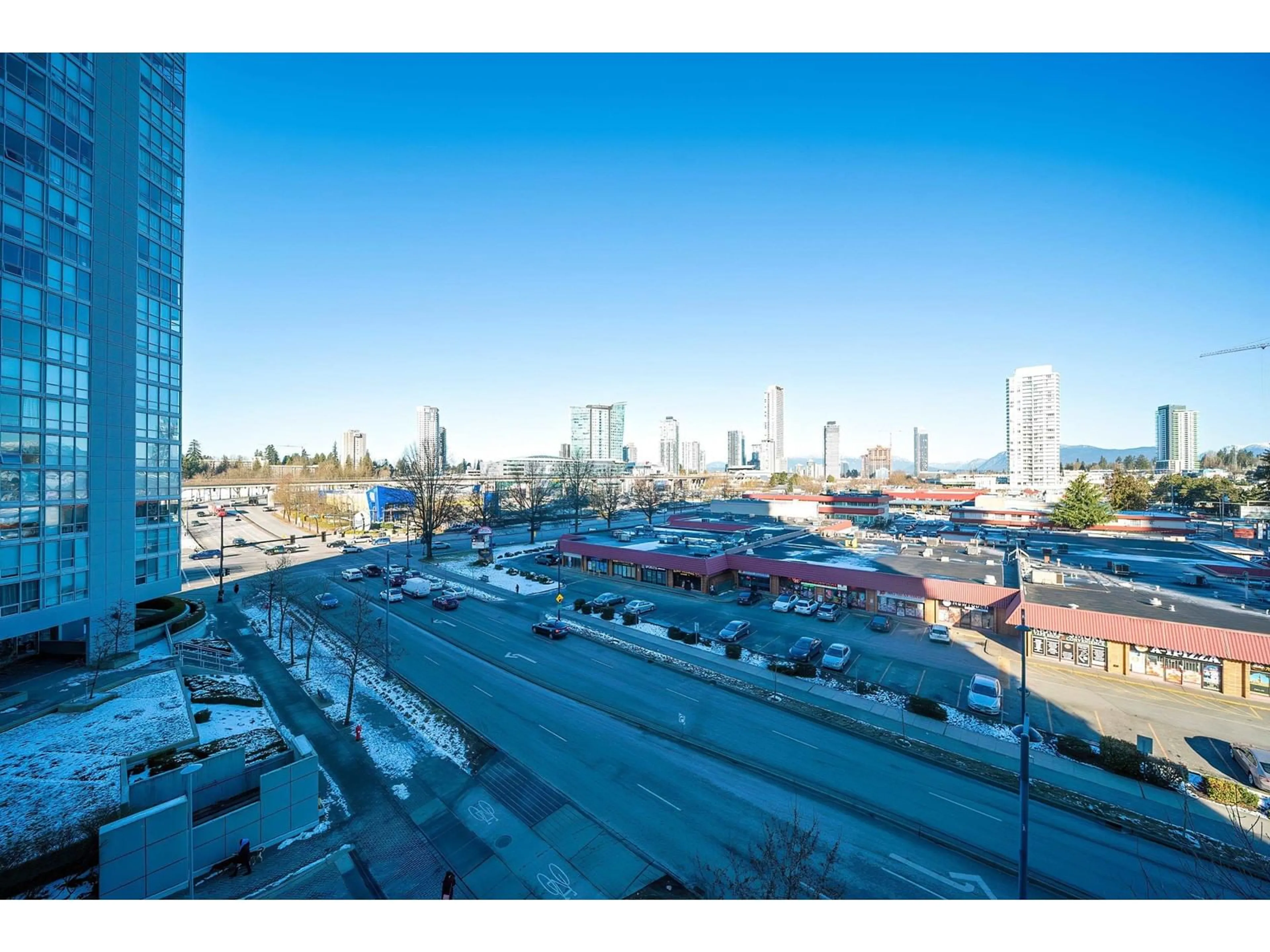 A pic from outside/outdoor area/front of a property/back of a property/a pic from drone, city buildings view from balcony for 504 - 13688 100, Surrey British Columbia V3T0G5