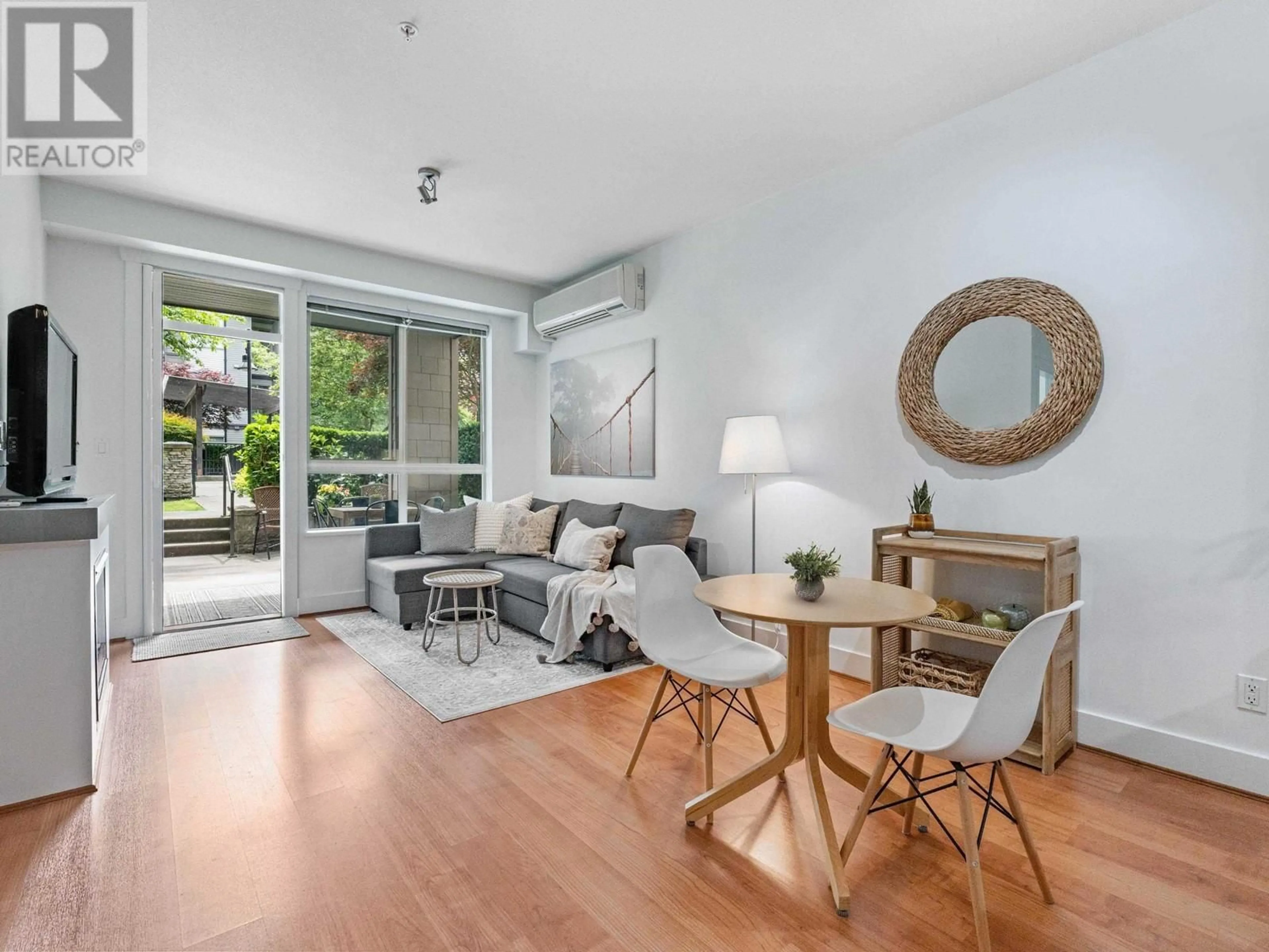 Living room with furniture, wood/laminate floor for 208 - 7428 BYRNEPARK WALK, Burnaby British Columbia V3N0B4