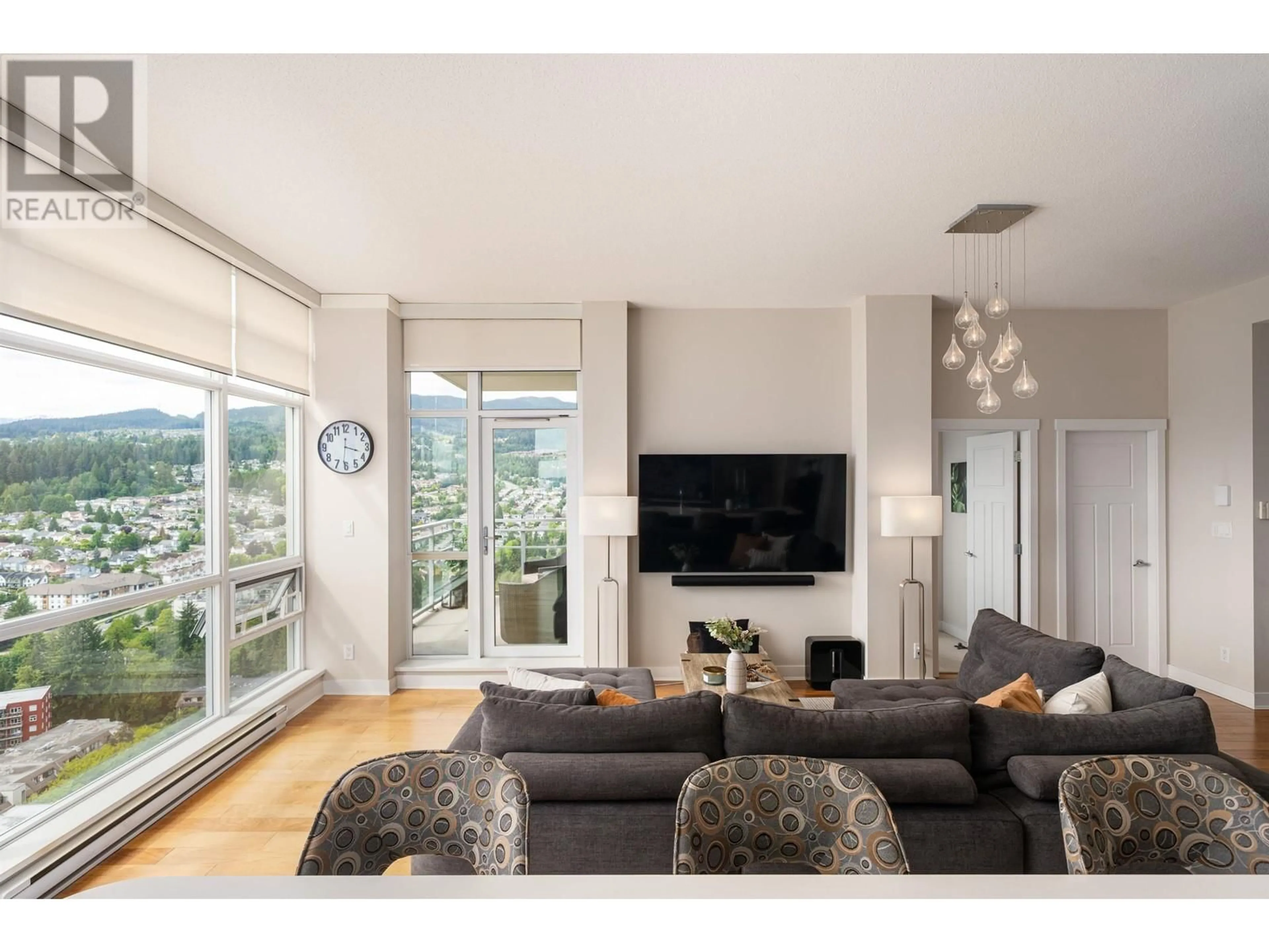 Living room with furniture, wood/laminate floor for 3401 - 2968 GLEN DRIVE, Coquitlam British Columbia V3B0C4