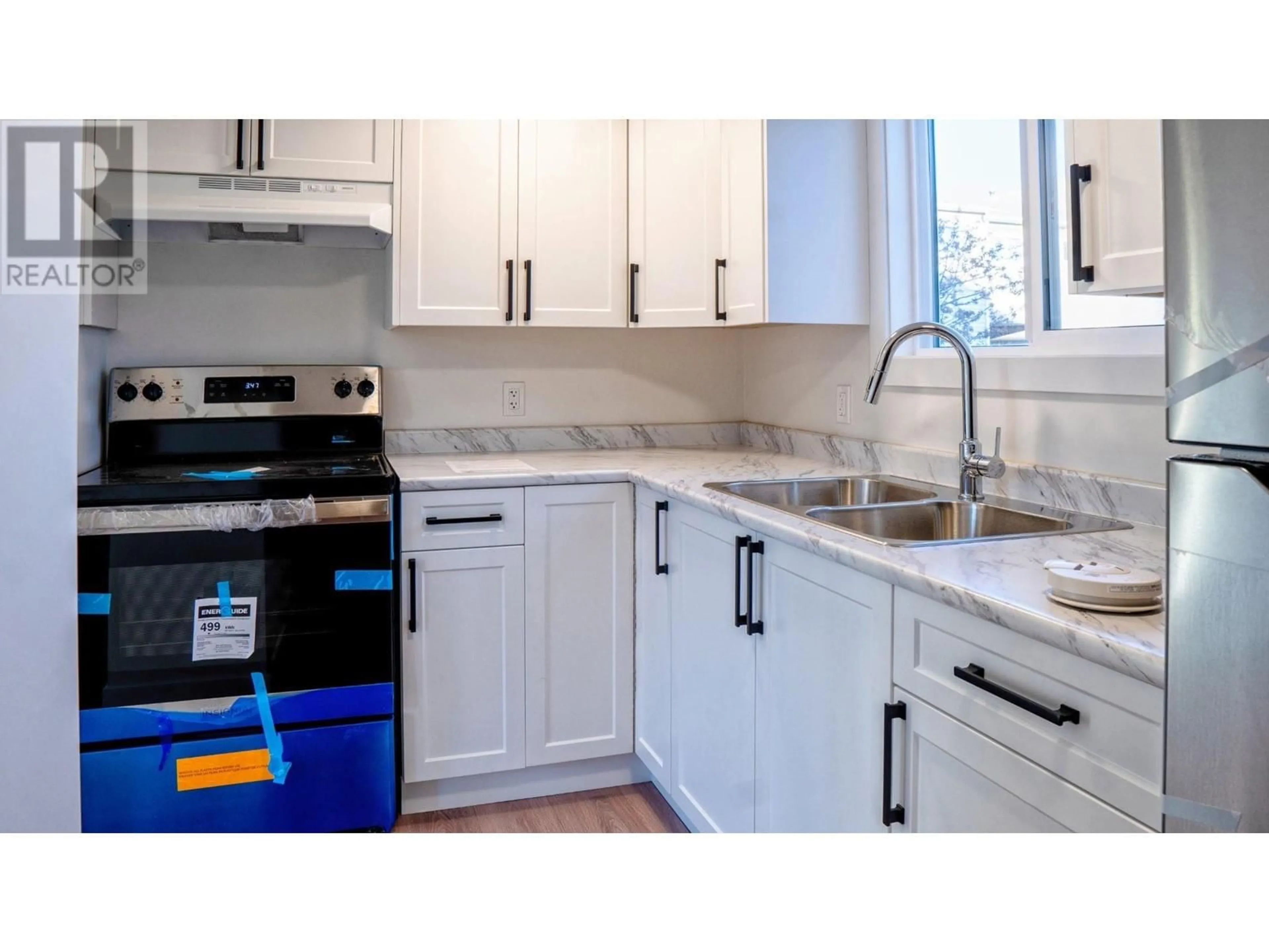 Standard kitchen, ceramic/tile floor for 8904 101 AVENUE, Fort St. John British Columbia V1J5G2