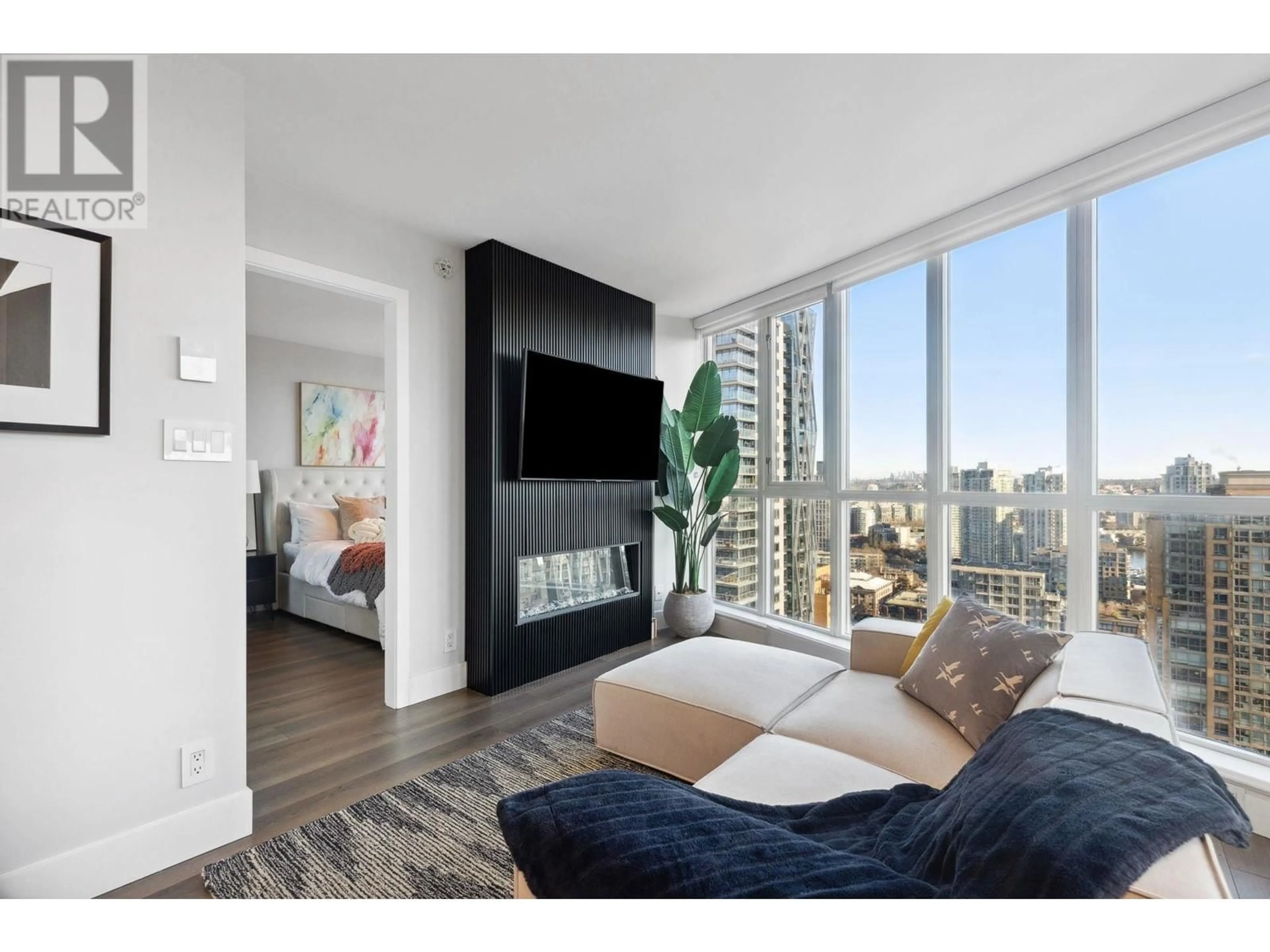 Living room with furniture, wood/laminate floor for 2406 - 1155 SEYMOUR STREET, Vancouver British Columbia V6B1K2