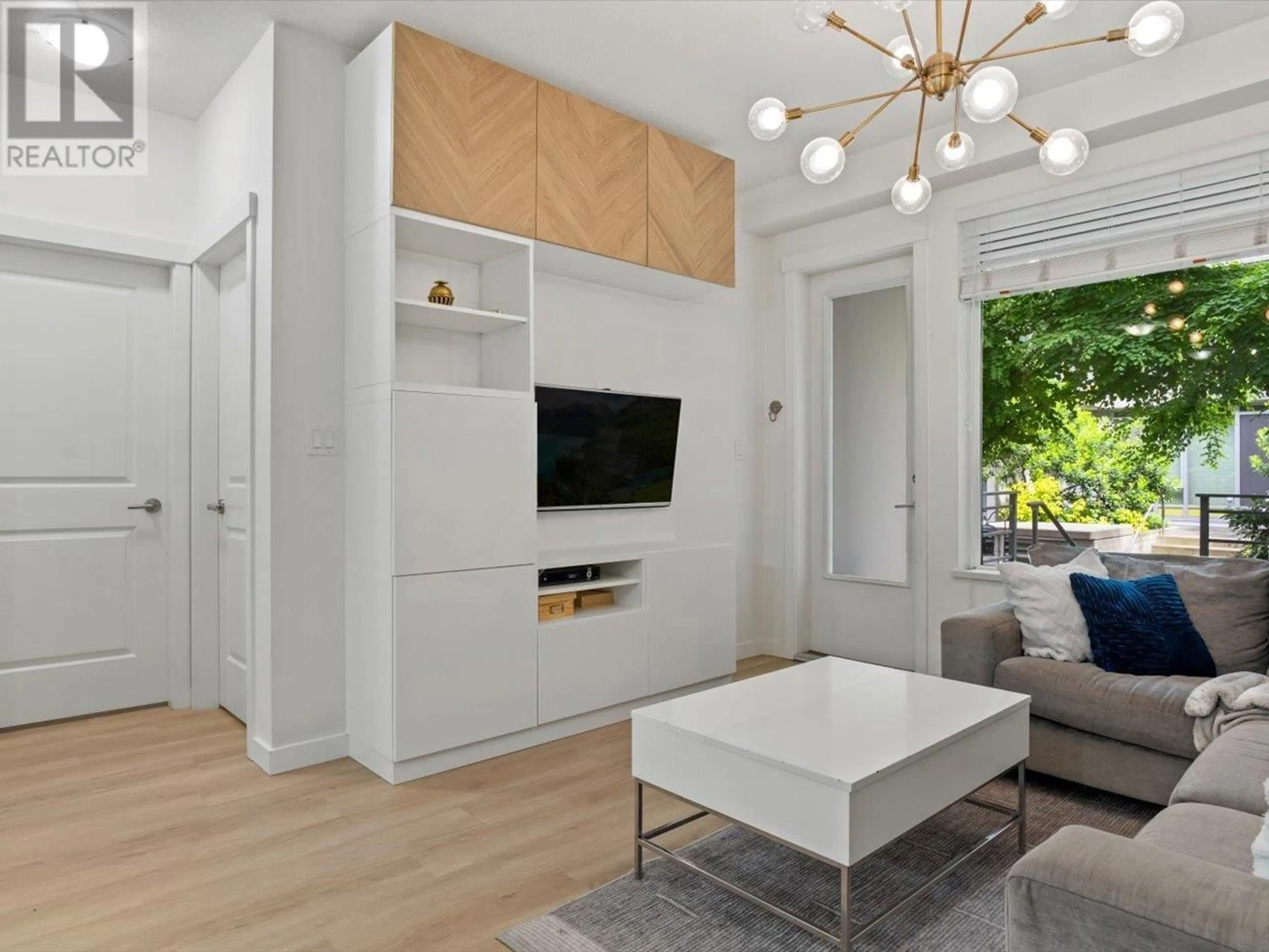 Living room with furniture, wood/laminate floor for 116 - 3138 RIVERWALK AVENUE, Vancouver British Columbia V5S0B6