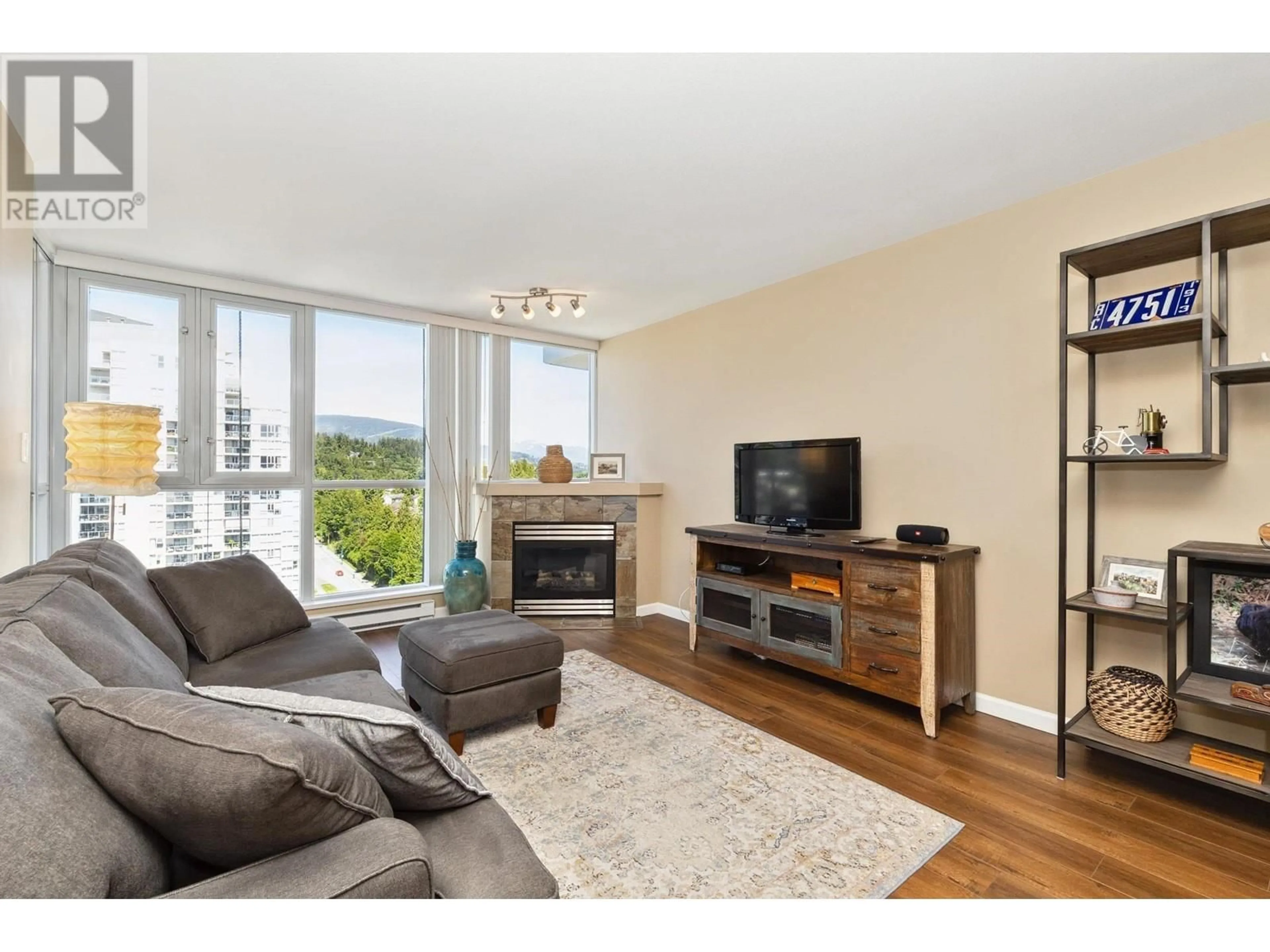 Living room with furniture, wood/laminate floor for 1706 - 235 GUILDFORD WAY, Port Moody British Columbia V3H5L8