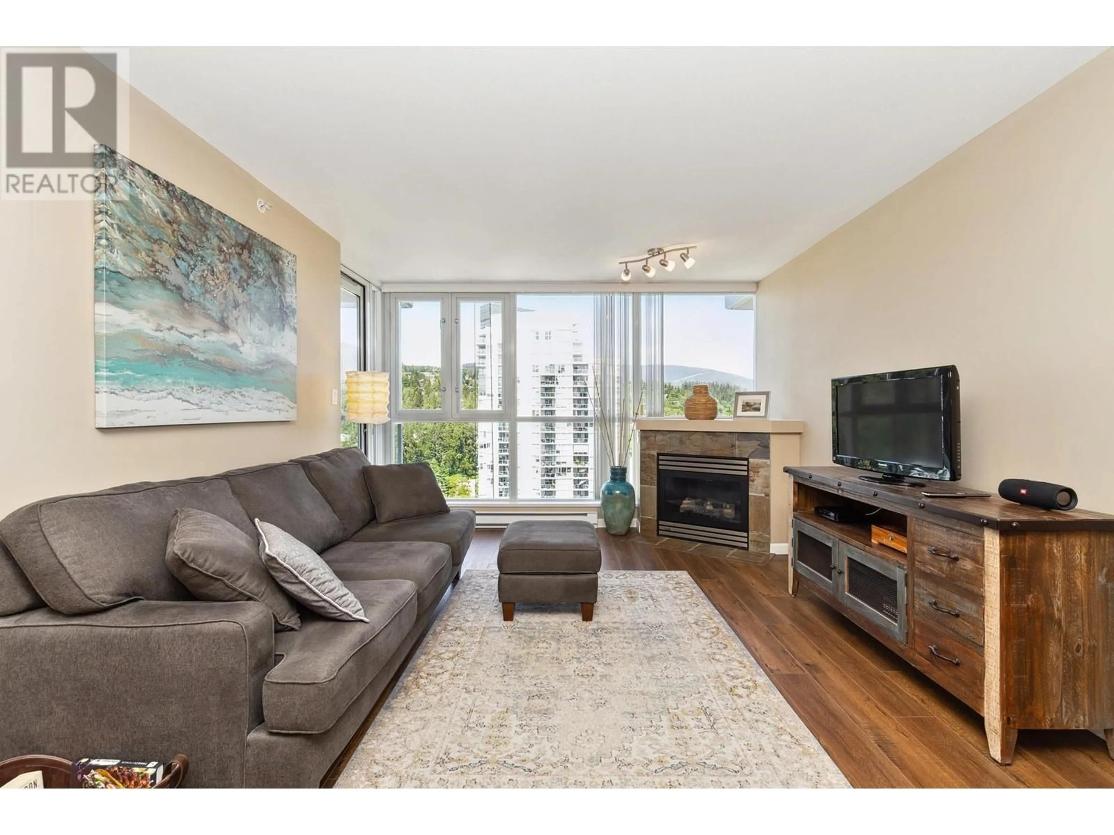 Living room with furniture, wood/laminate floor for 1706 - 235 GUILDFORD WAY, Port Moody British Columbia V3H5L8