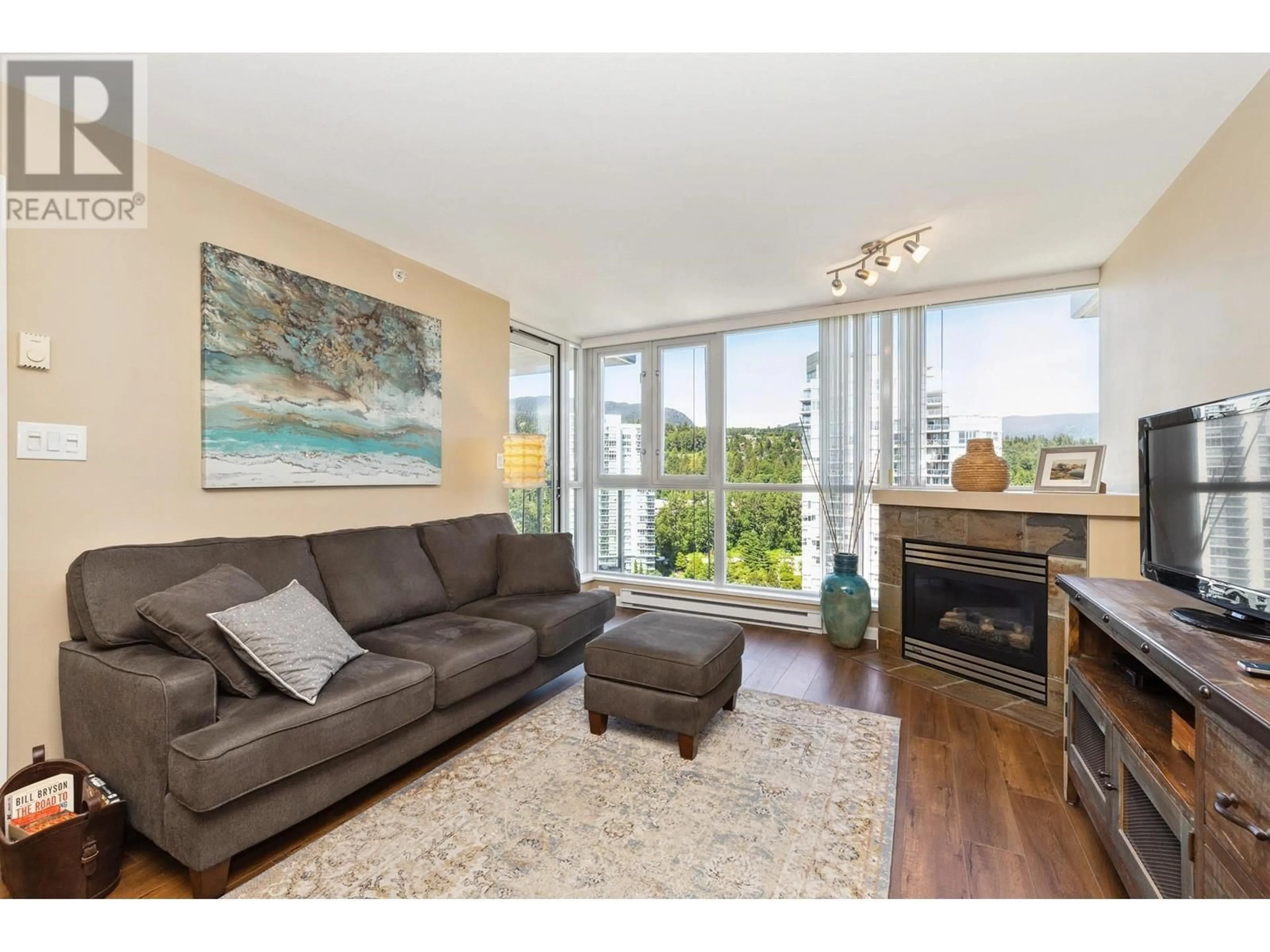 Living room with furniture, wood/laminate floor for 1706 - 235 GUILDFORD WAY, Port Moody British Columbia V3H5L8