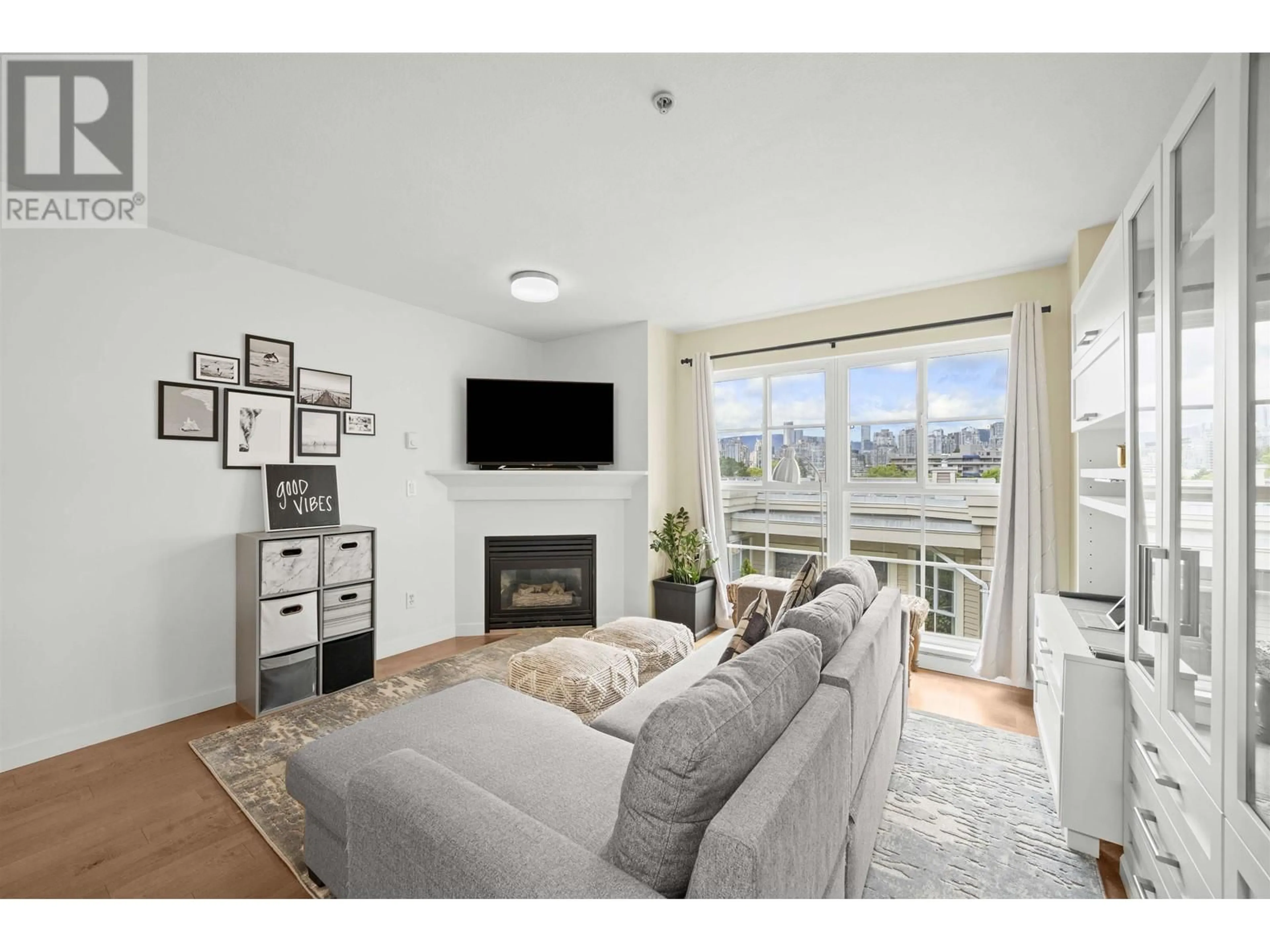 Living room with furniture, wood/laminate floor for 317 - 678 7TH AVENUE, Vancouver British Columbia V5Z1B5