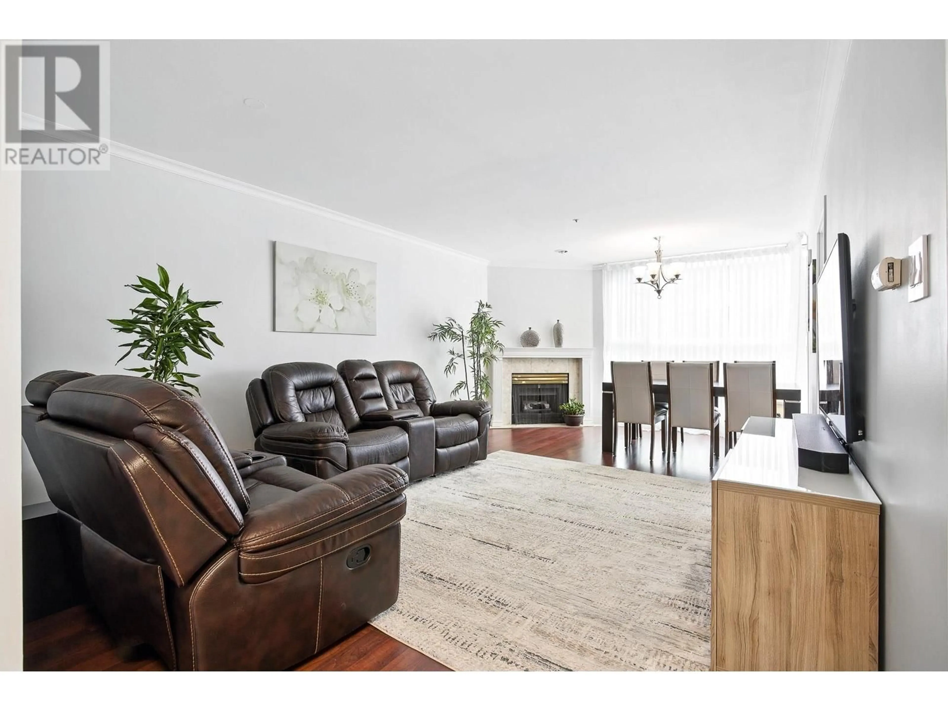 Living room with furniture, wood/laminate floor for 303 - 7700 GILBERT ROAD, Richmond British Columbia V7C3W2