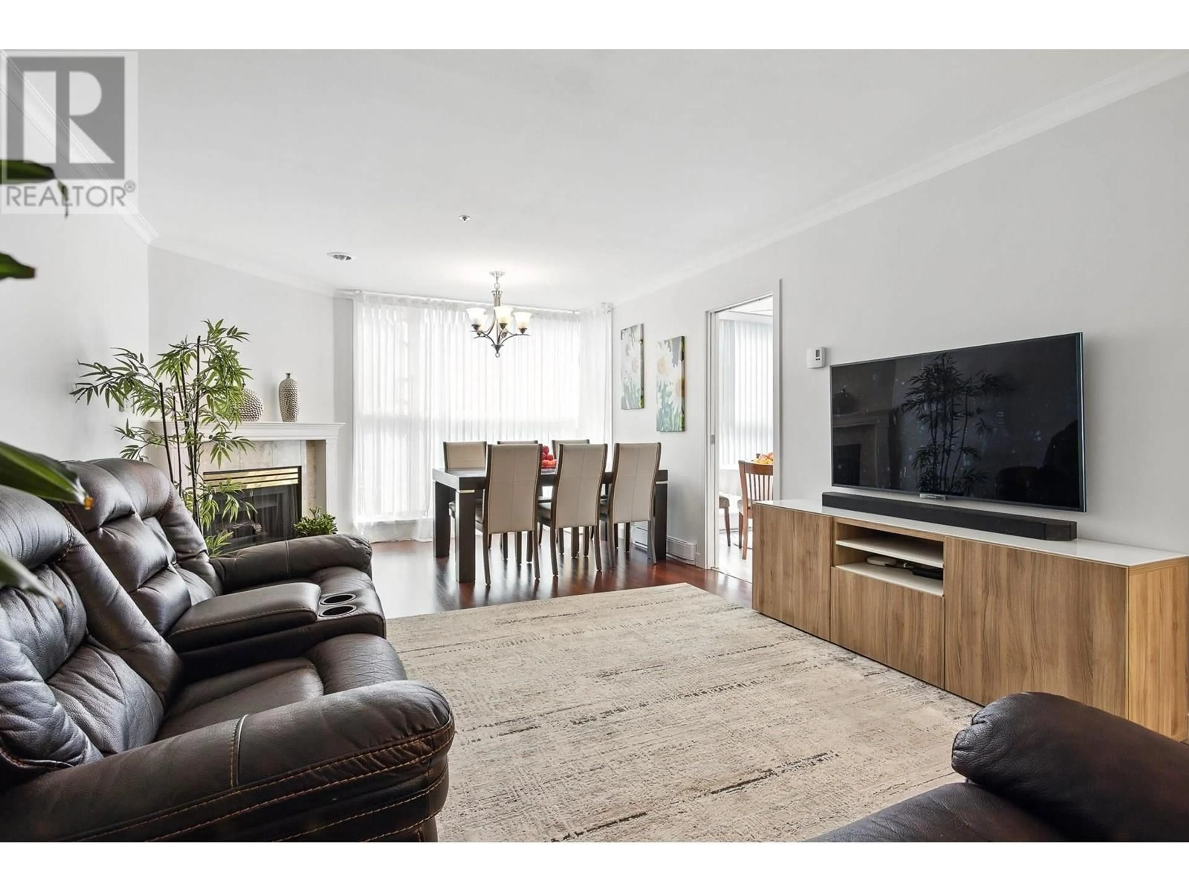 Living room with furniture, wood/laminate floor for 303 - 7700 GILBERT ROAD, Richmond British Columbia V7C3W2
