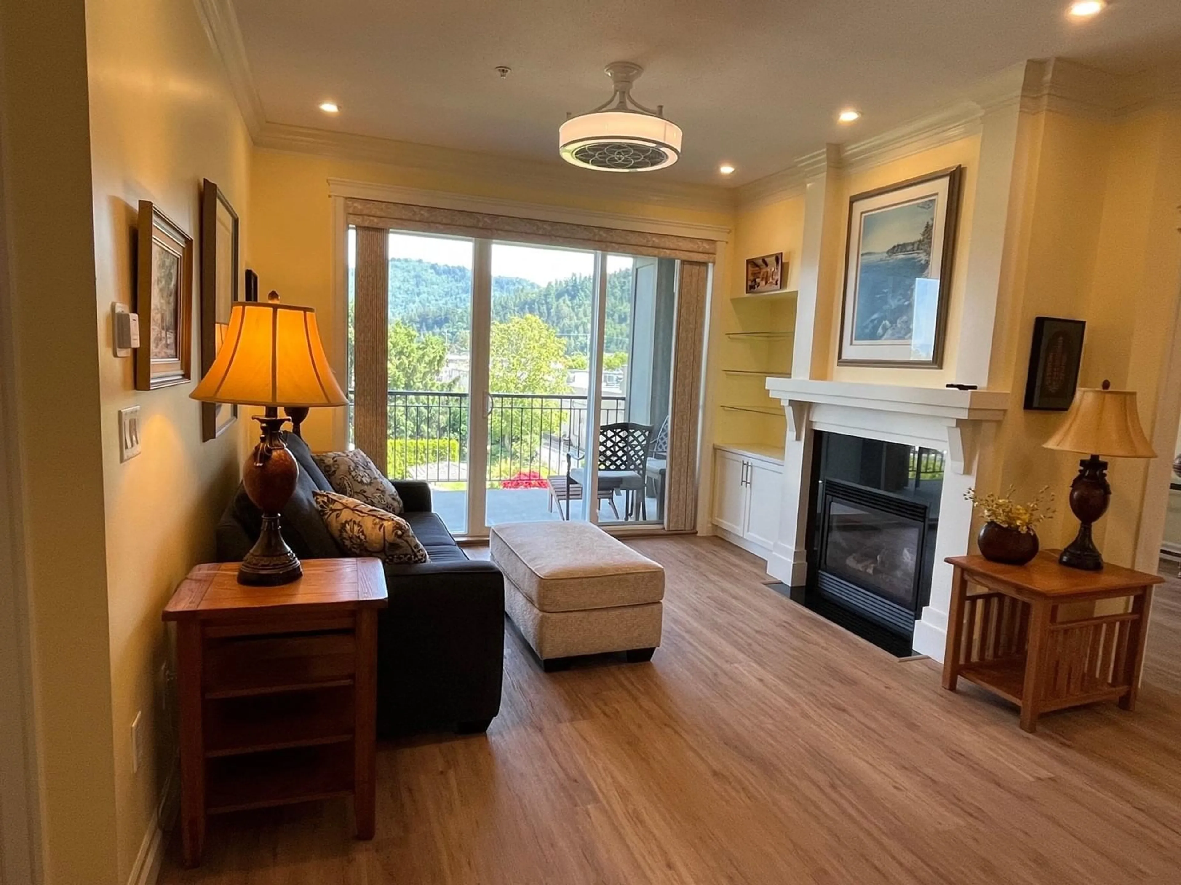 Living room with furniture, wood/laminate floor for 303C - 45595 TAMIHI WAY, Chilliwack British Columbia V2R0G3