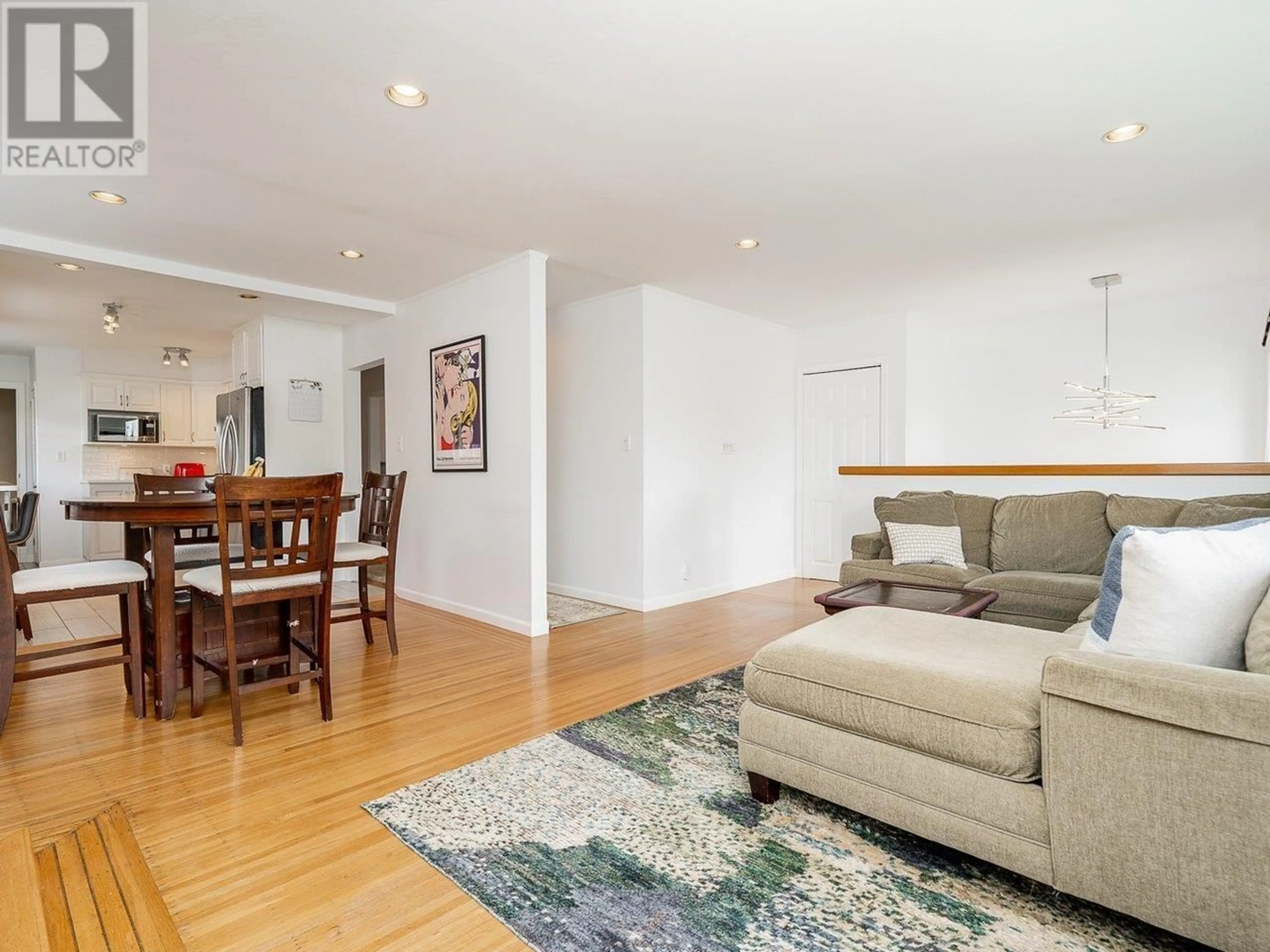 Living room with furniture, wood/laminate floor for 8278 18TH AVENUE, Burnaby British Columbia V3N1K3