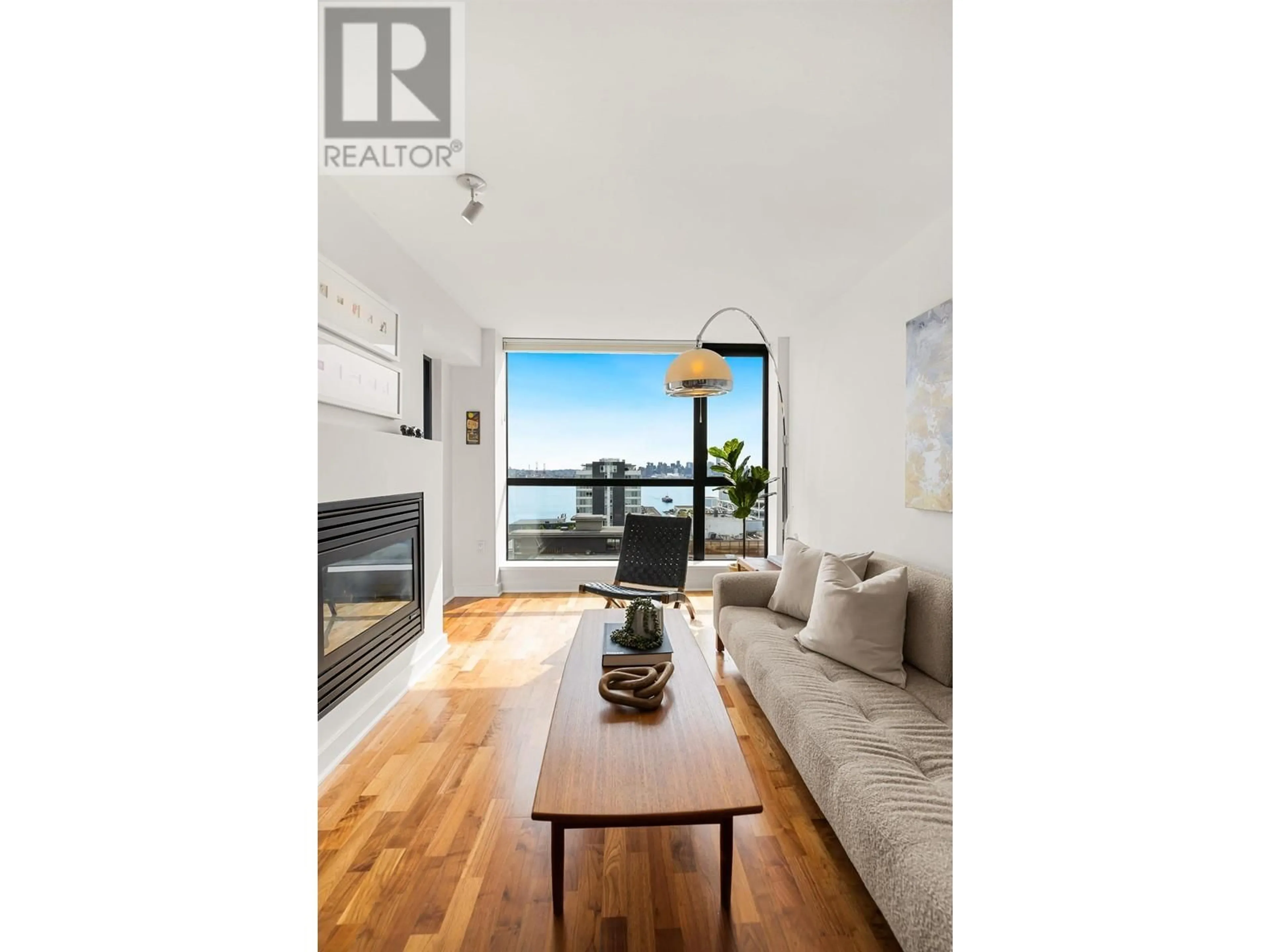 Living room with furniture, wood/laminate floor for 1103 - 124 1ST STREET, North Vancouver British Columbia V7M3N3