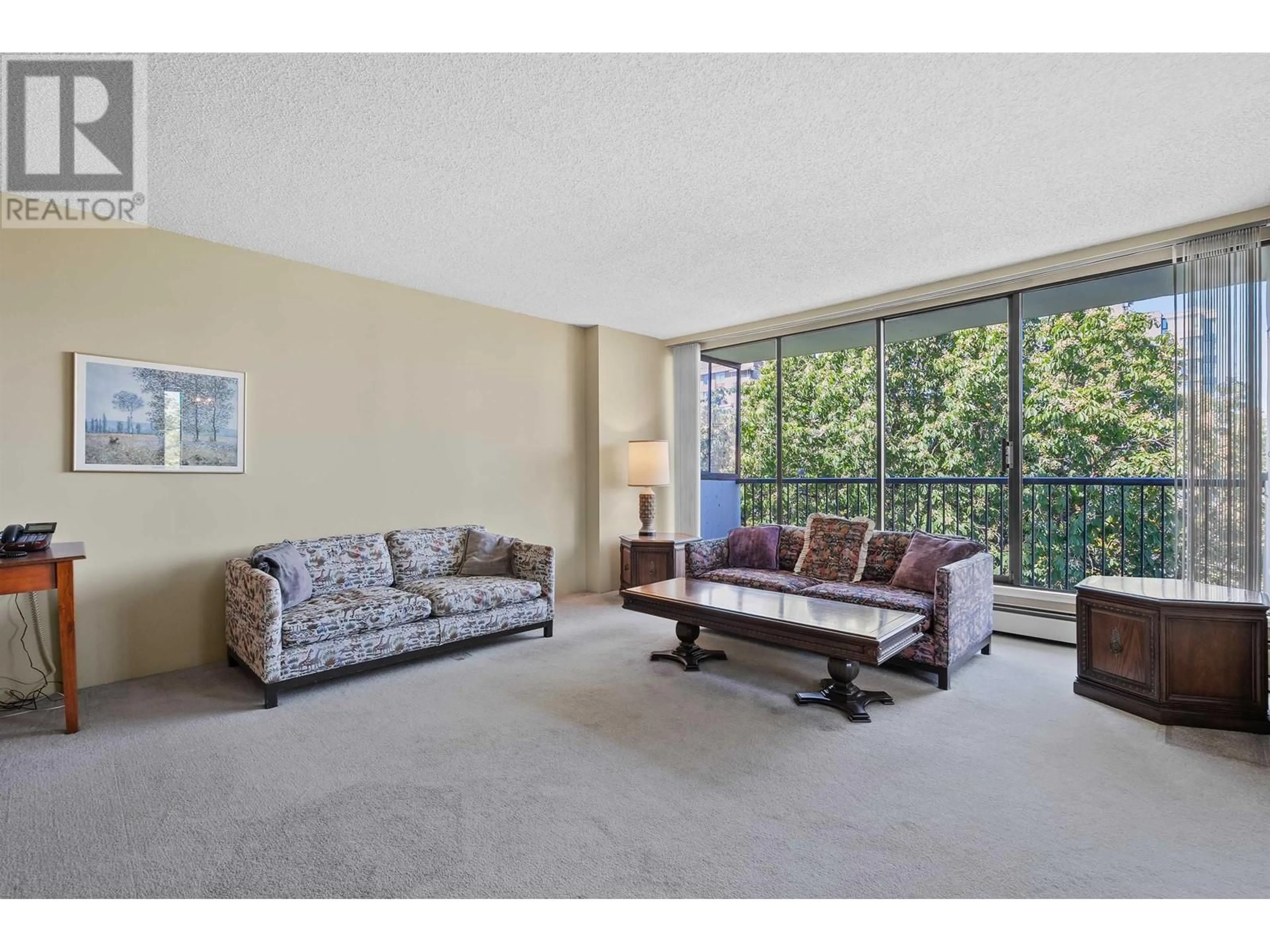 Living room with furniture, carpet floor for 601 - 5555 YEW STREET, Vancouver British Columbia V6M3X9