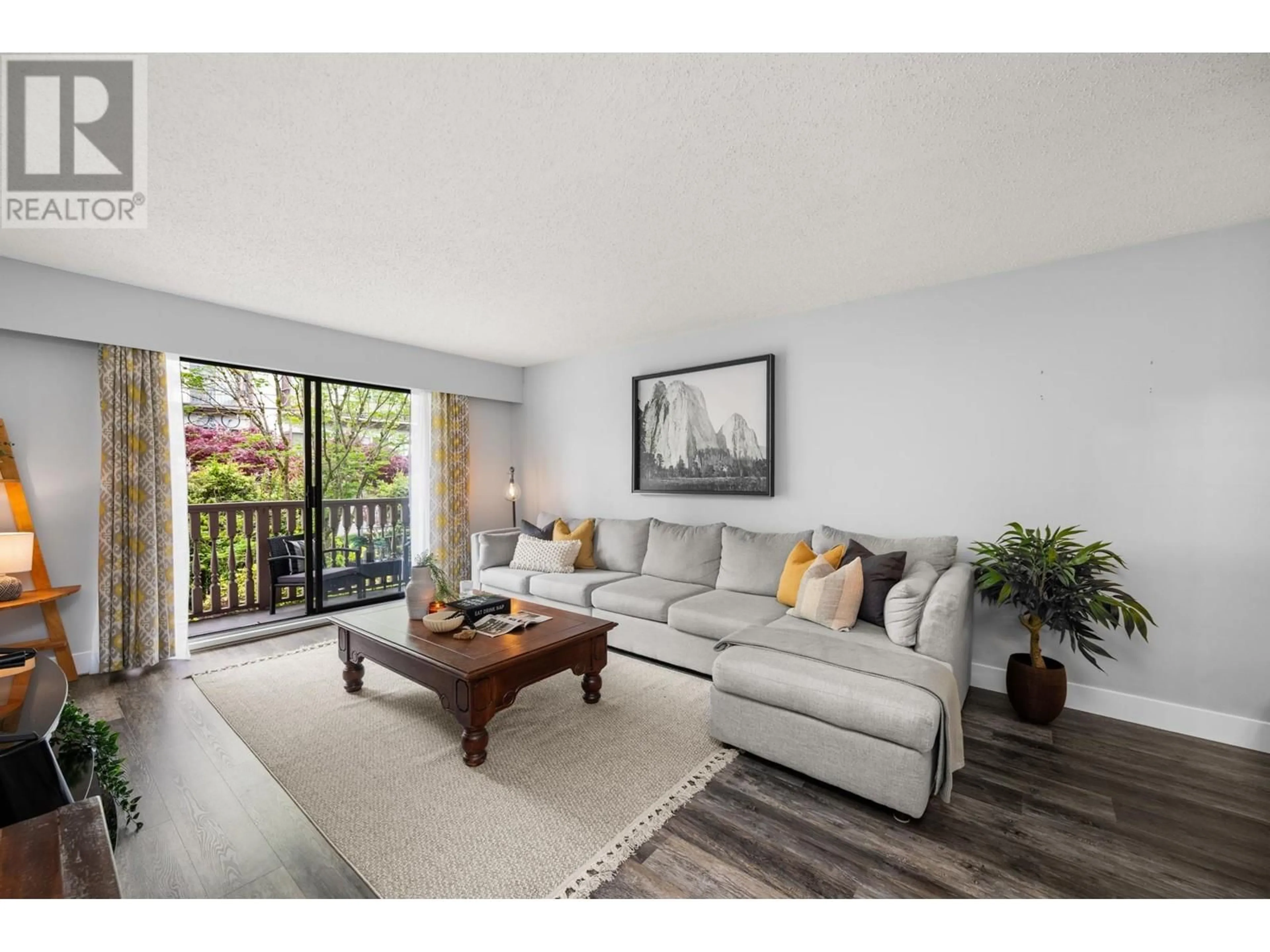 Living room with furniture, wood/laminate floor for 211 - 236 2ND STREET, North Vancouver British Columbia V7M1C6
