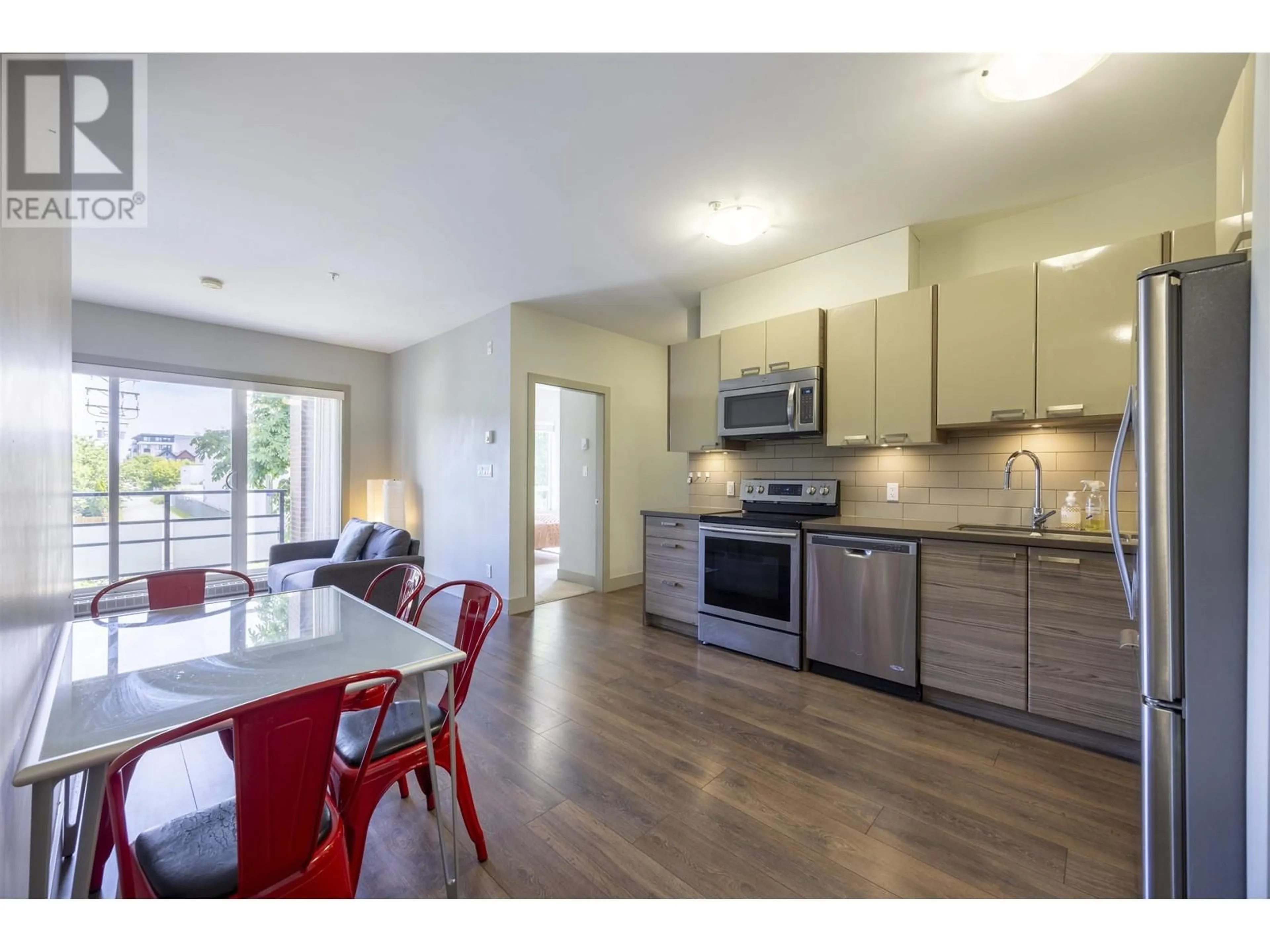 Open concept kitchen, wood/laminate floor for 210 - 6875 DUNBLANE AVENUE, Burnaby British Columbia V5J0G6